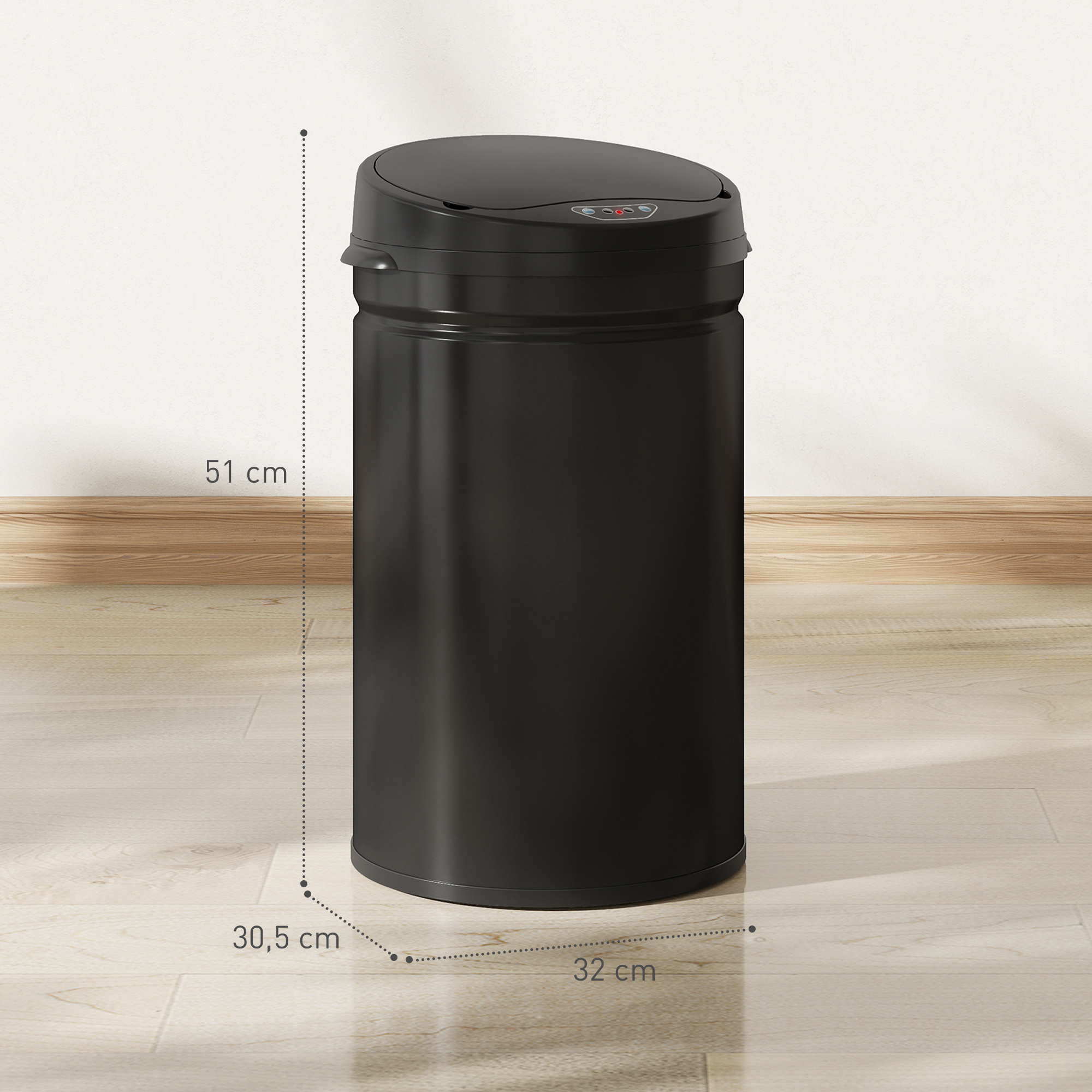 Un cubo de basura negro con tapa sensible está sobre un suelo de madera.