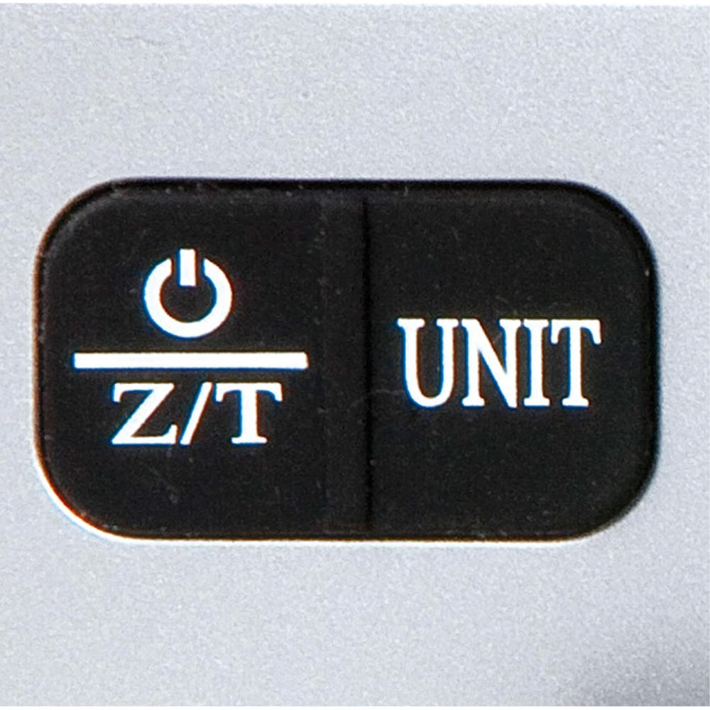 Zwei schwarze Knöpfe auf einem silbernen Gerät. Links 'Z/T' mit Power-Symbol.