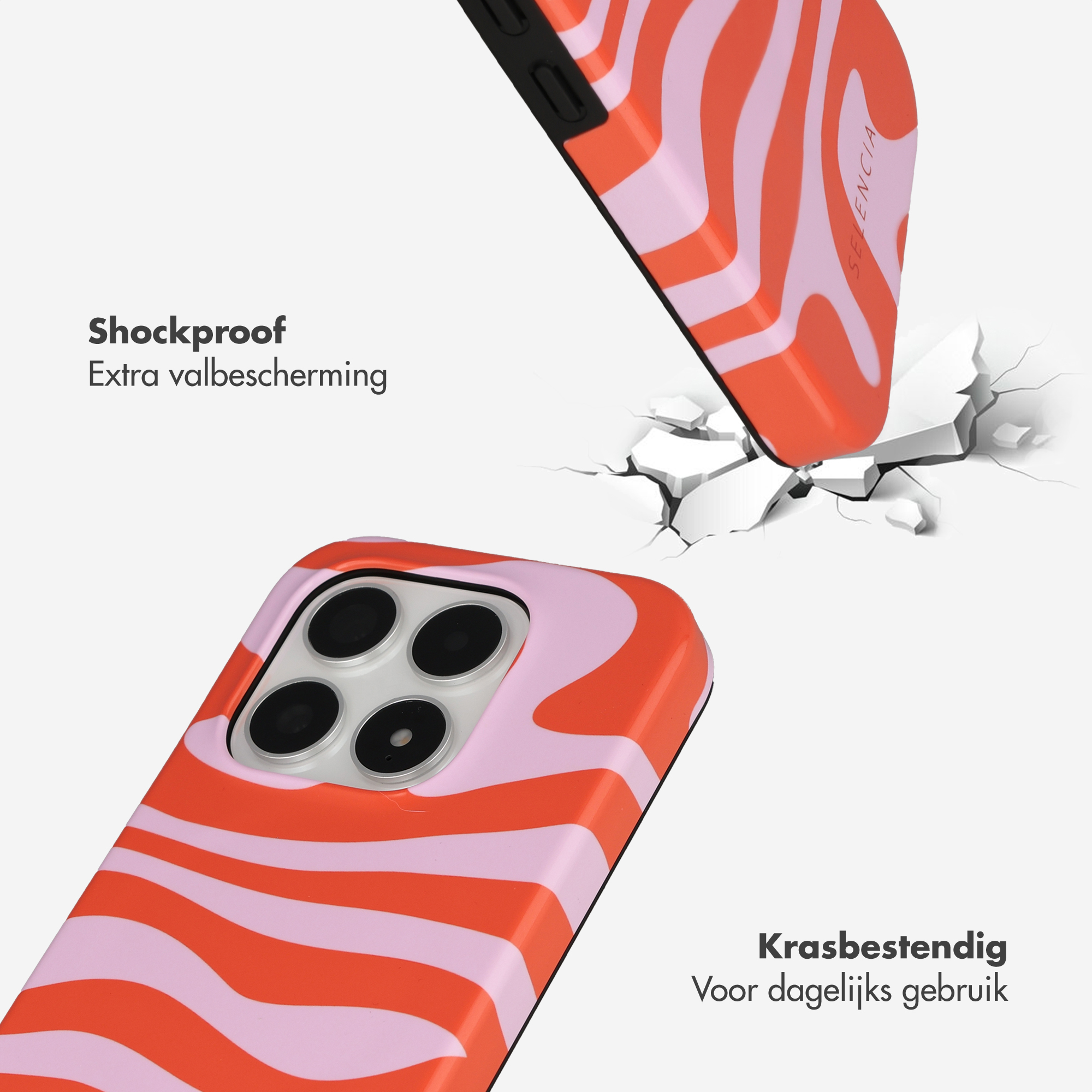 Coque de téléphone rayée orange et rose traversant une surface.