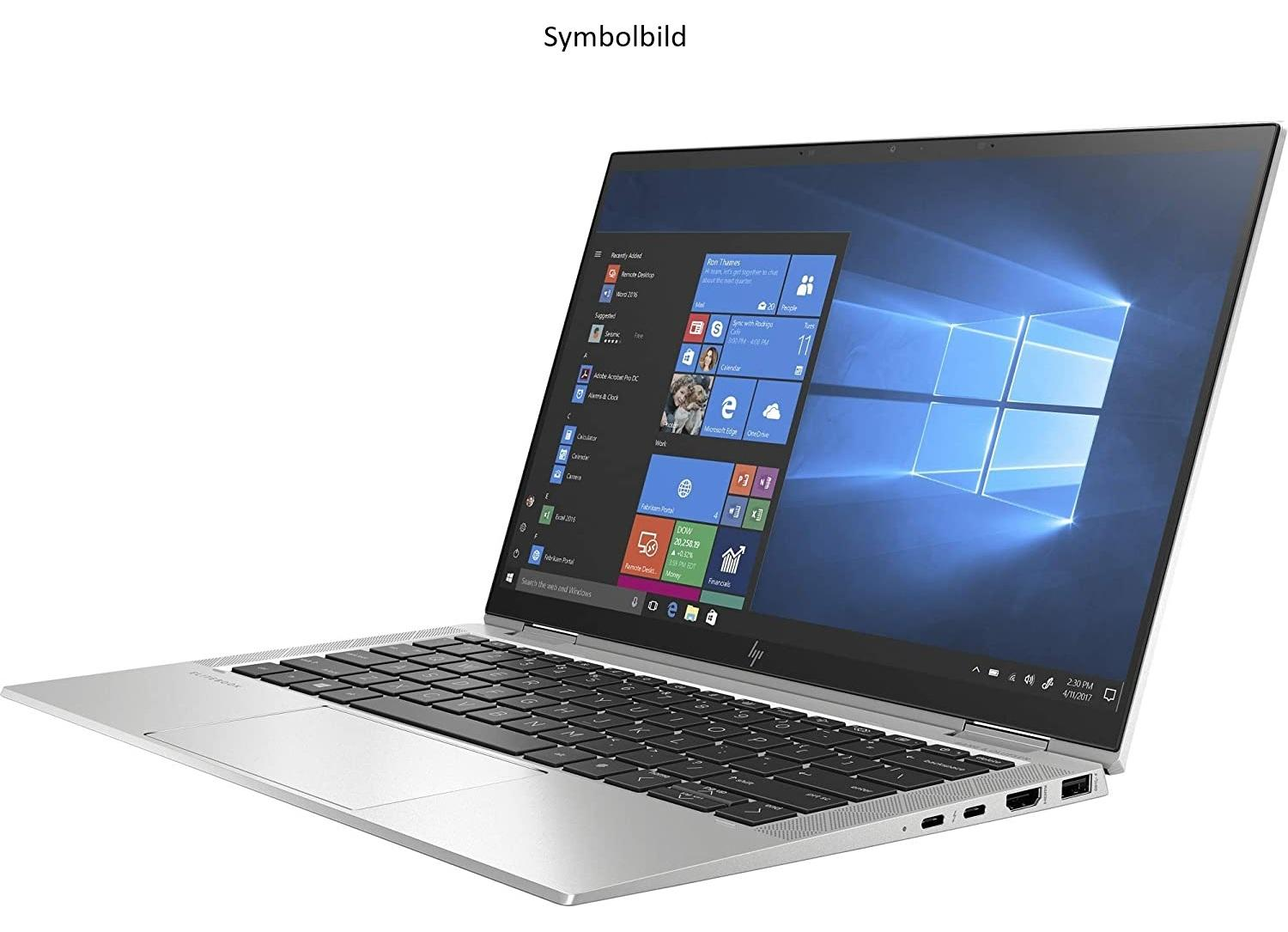 Ein silberner Laptop mit einem beleuchteten Bildschirm, der das Windows-Betriebssystem anzeigt.