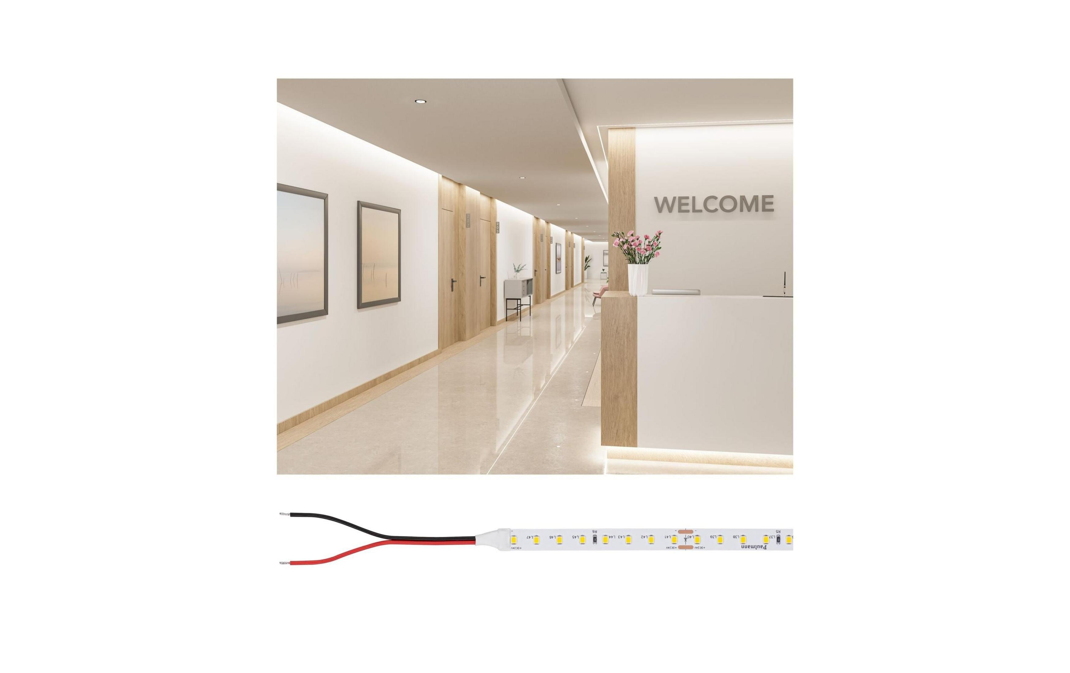 Recepcja z napisem "Welcome" i korytarzem, poniżej paski LED.