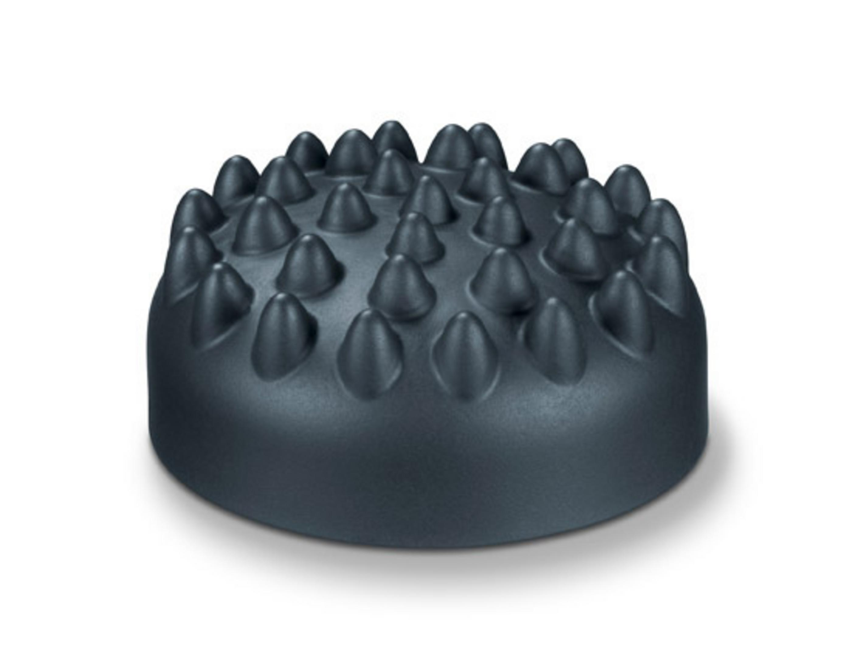 Un accessorio massaggiante nero con molte piccole sporgenze.