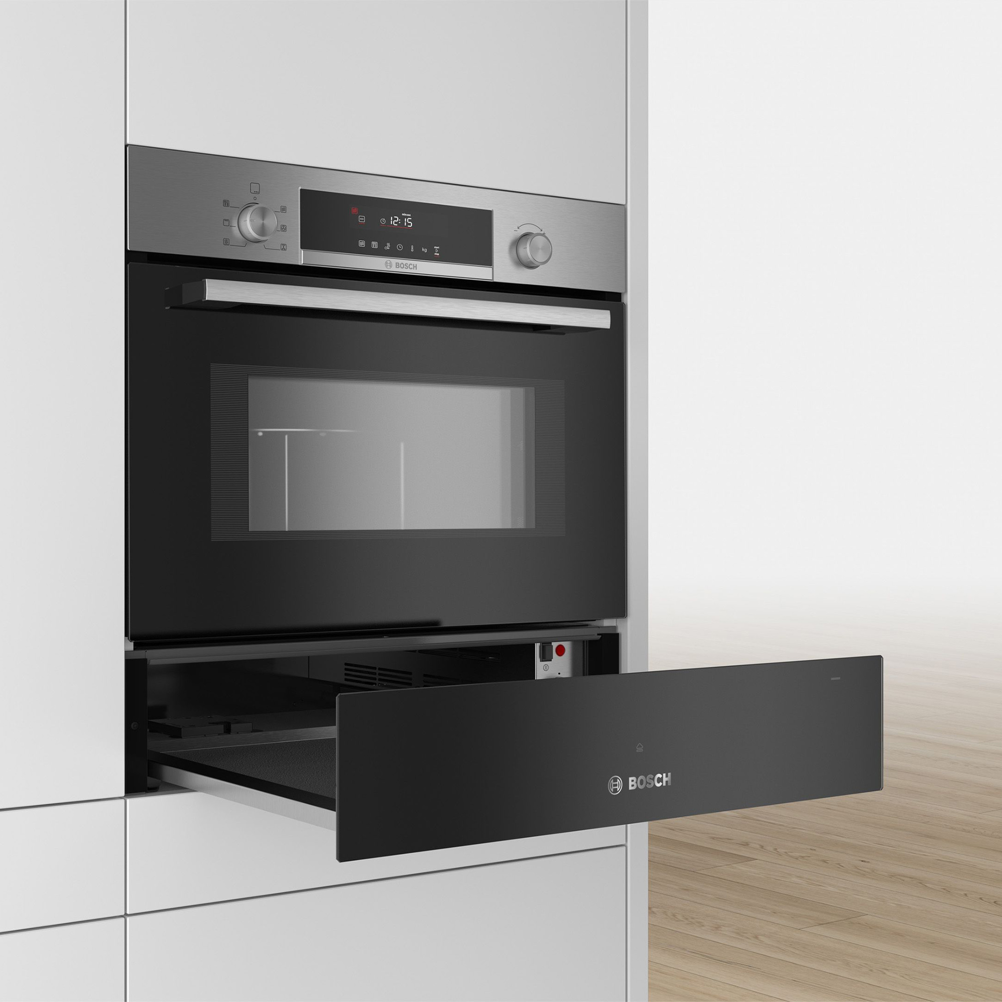 Four encastrable en inox avec porte noire et tiroir extractible.