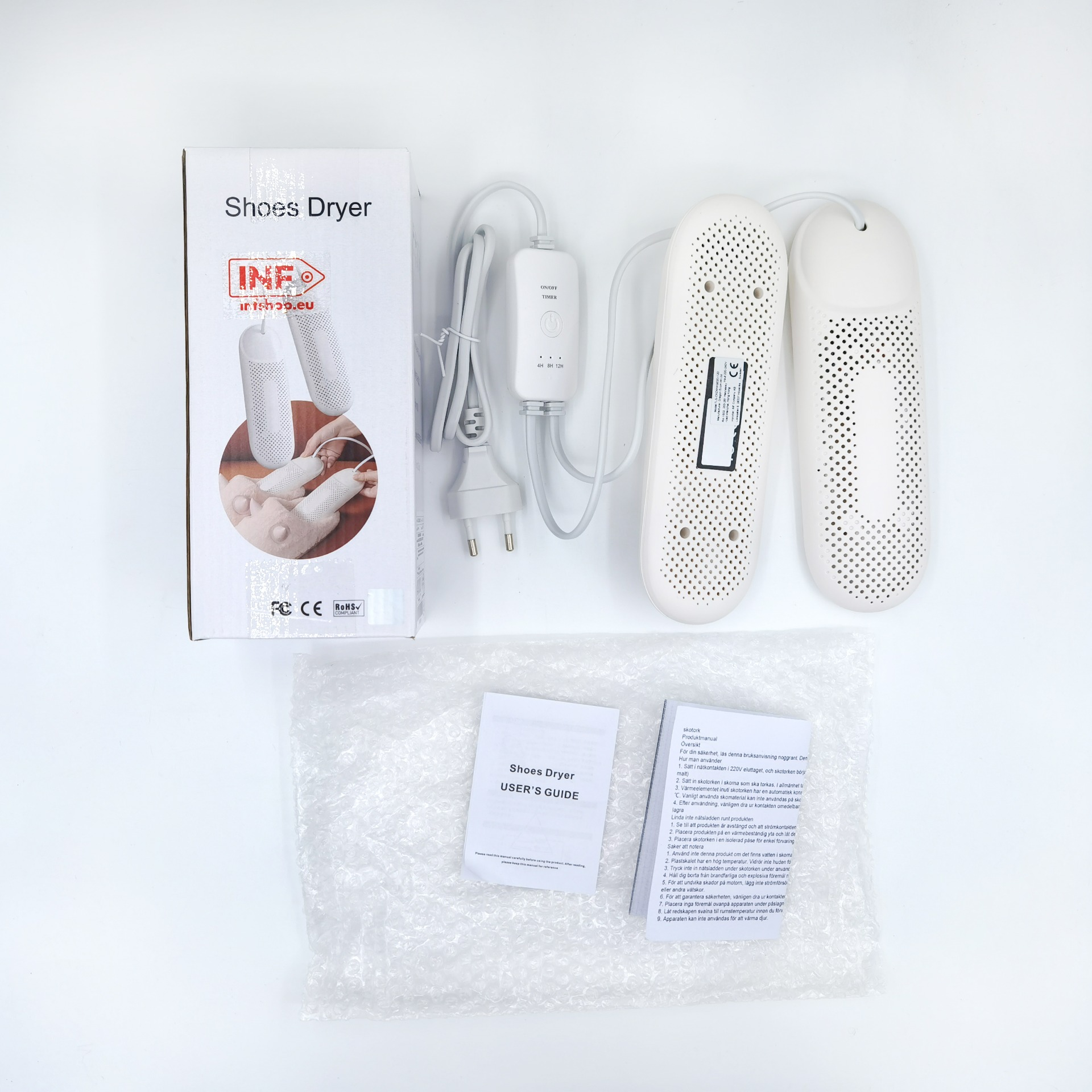Un asciugascarpe bianco con accessori, manuale utente e imballaggio.