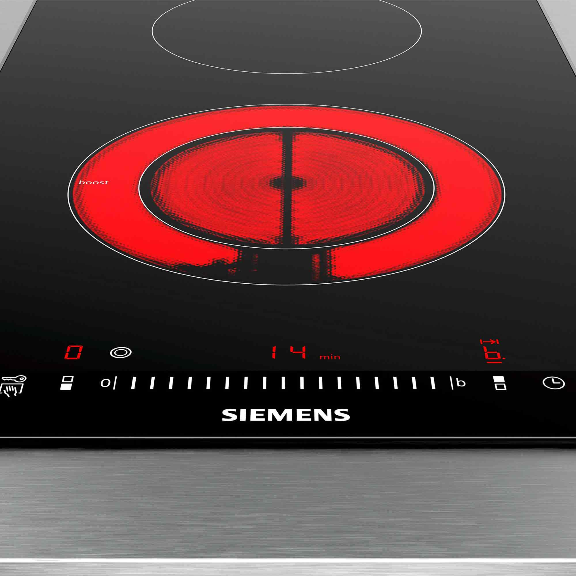 Czarna płyta indukcyjna z czerwoną spiralą grzewczą i cyfrowymi elementami sterującymi.
