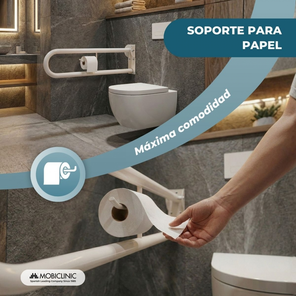 Una mano dispensa papel higiénico de un rollo montado en una barra de apoyo en un baño moderno.
