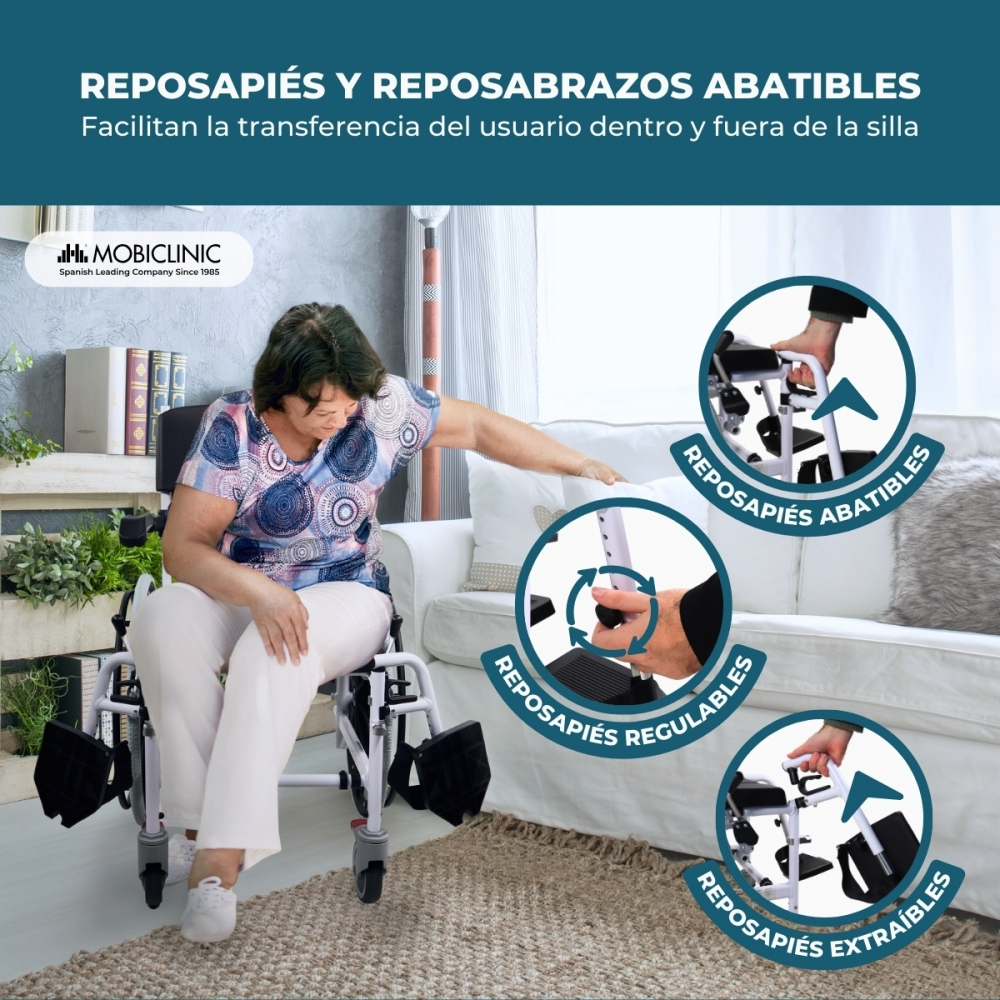 Mujer en silla de ruedas junto a un sofá. Detalles muestran reposapiés abatibles, ajustables.