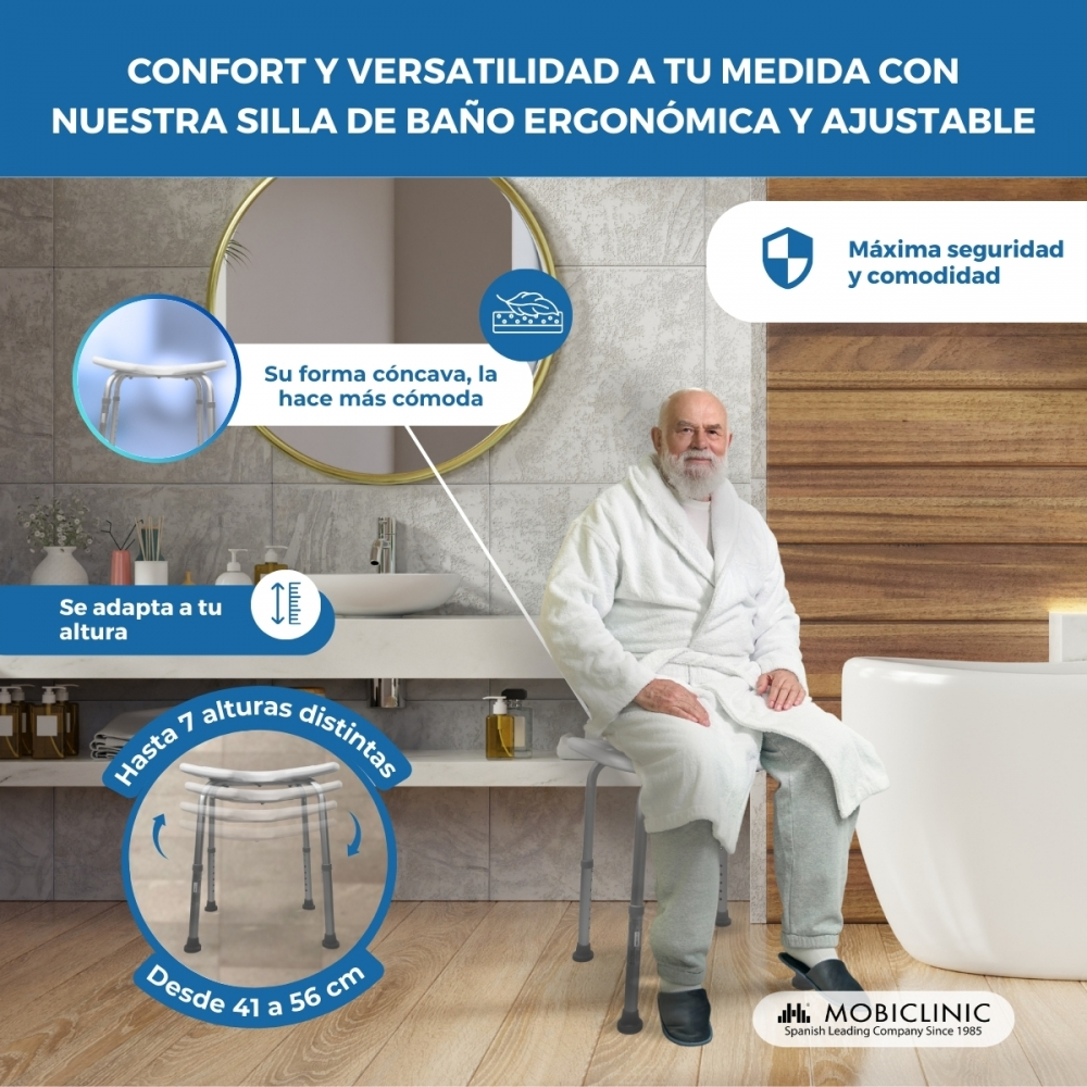 Un anciano se sienta en un taburete de ducha ajustable en un baño.