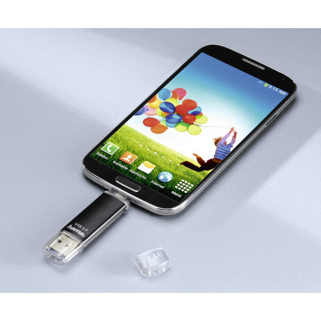 Uno smartphone collegato a un'unità USB, con una grafica di palloncini colorati.