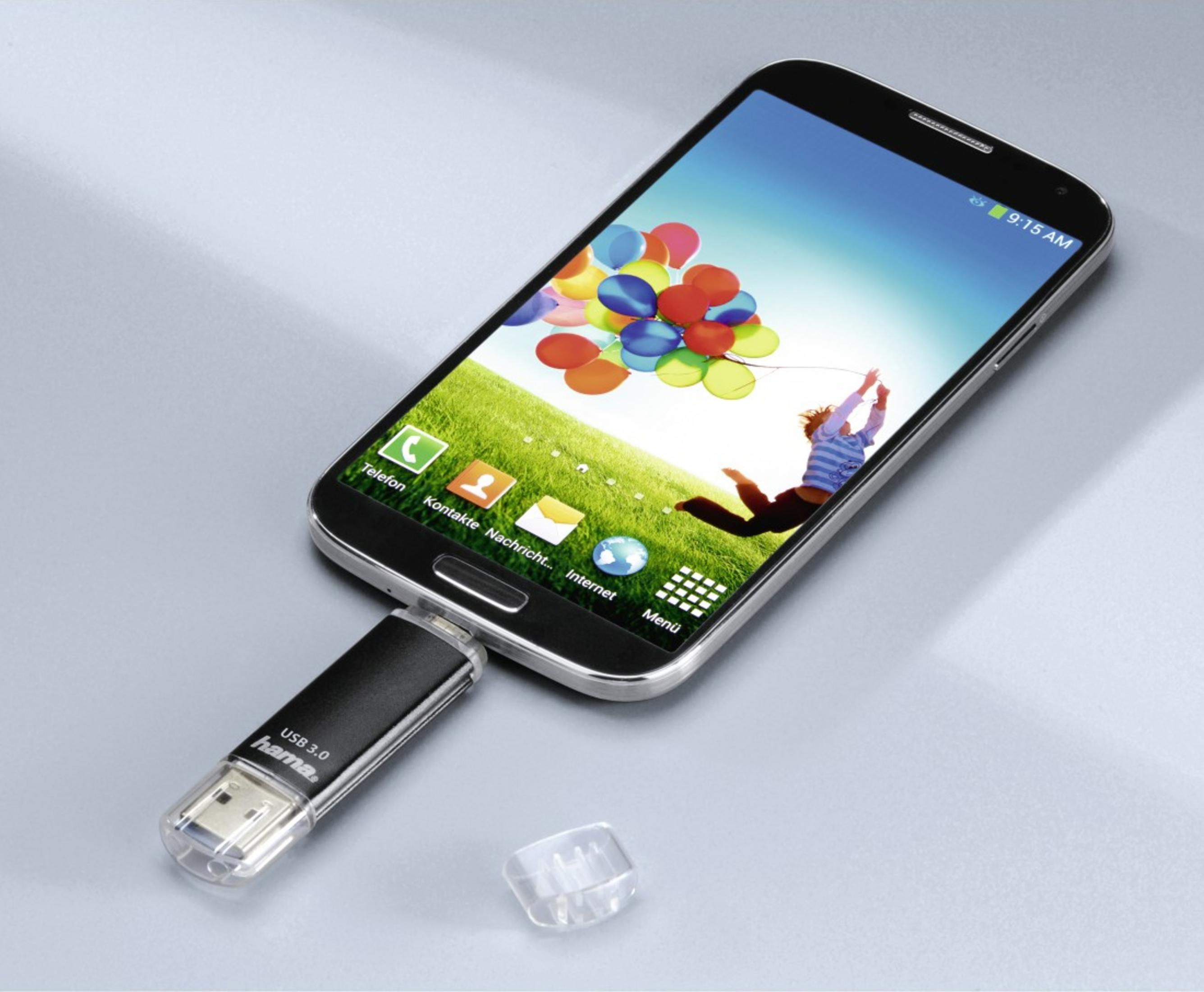 Uno smartphone collegato a un'unità USB, con palloncini sullo schermo.