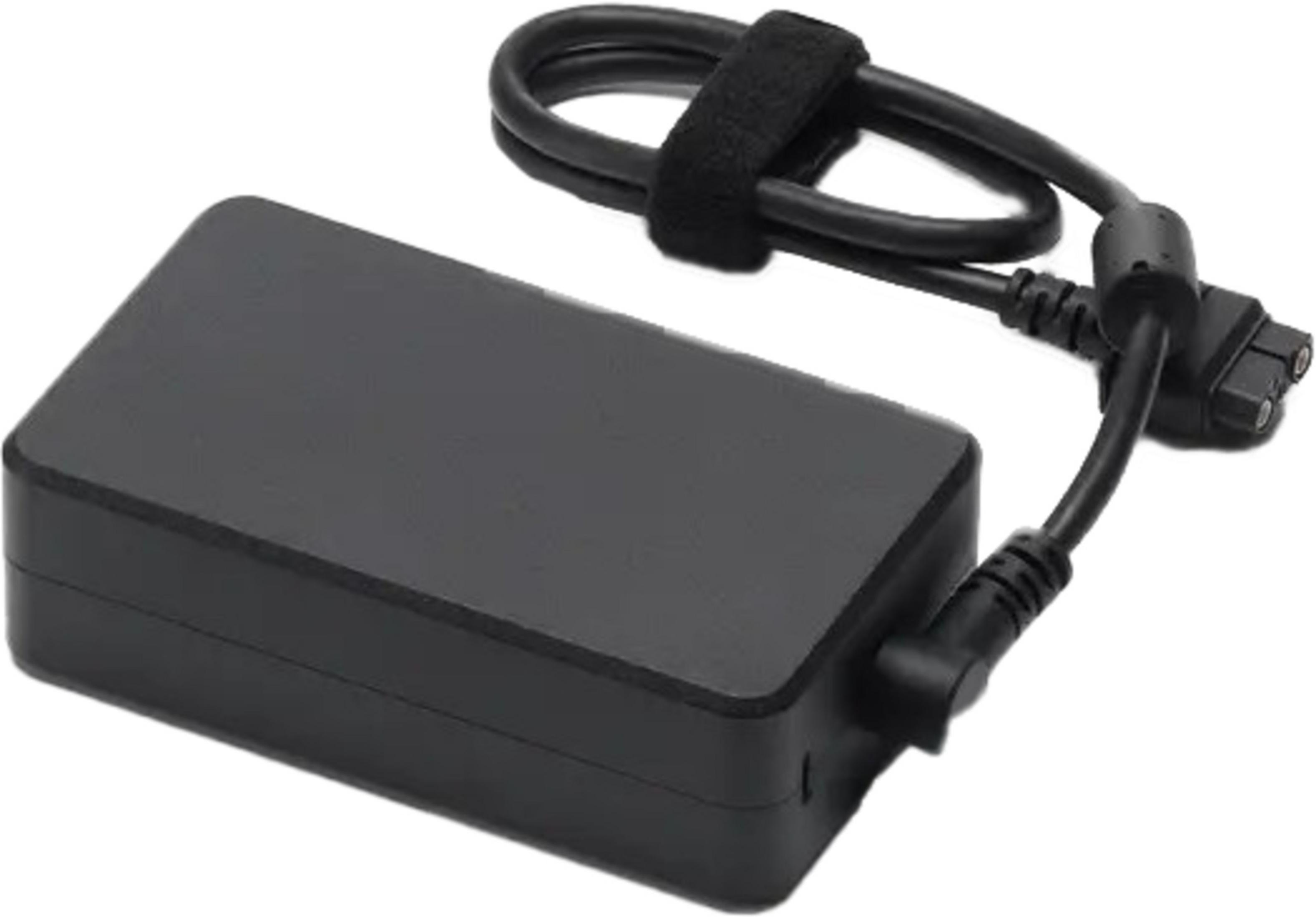 Un adaptador de corriente negro para portátil con un cable sujeto con velcro.