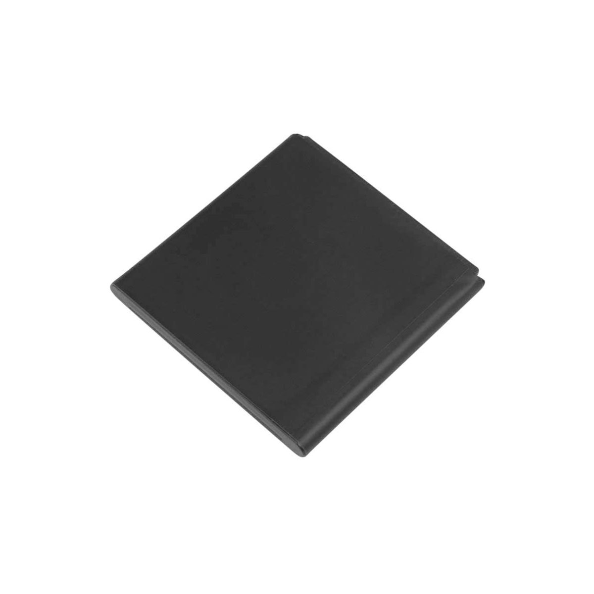 Un objeto rectangular negro yace sobre una superficie blanca.