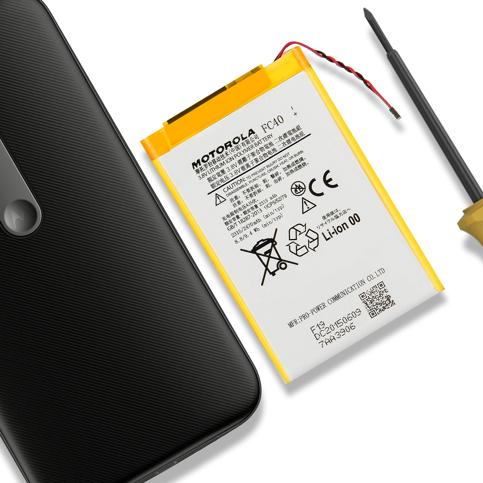Telefono Motorola nero accanto a una batteria, con attrezzo.