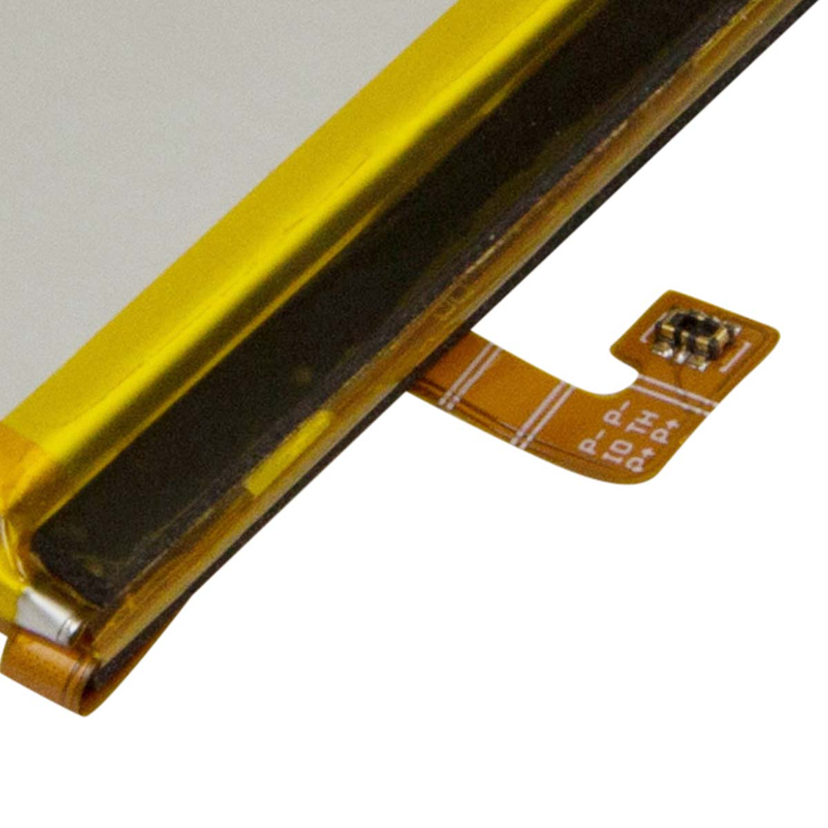 Un connettore flessibile a nastro piatto arancione con segni.