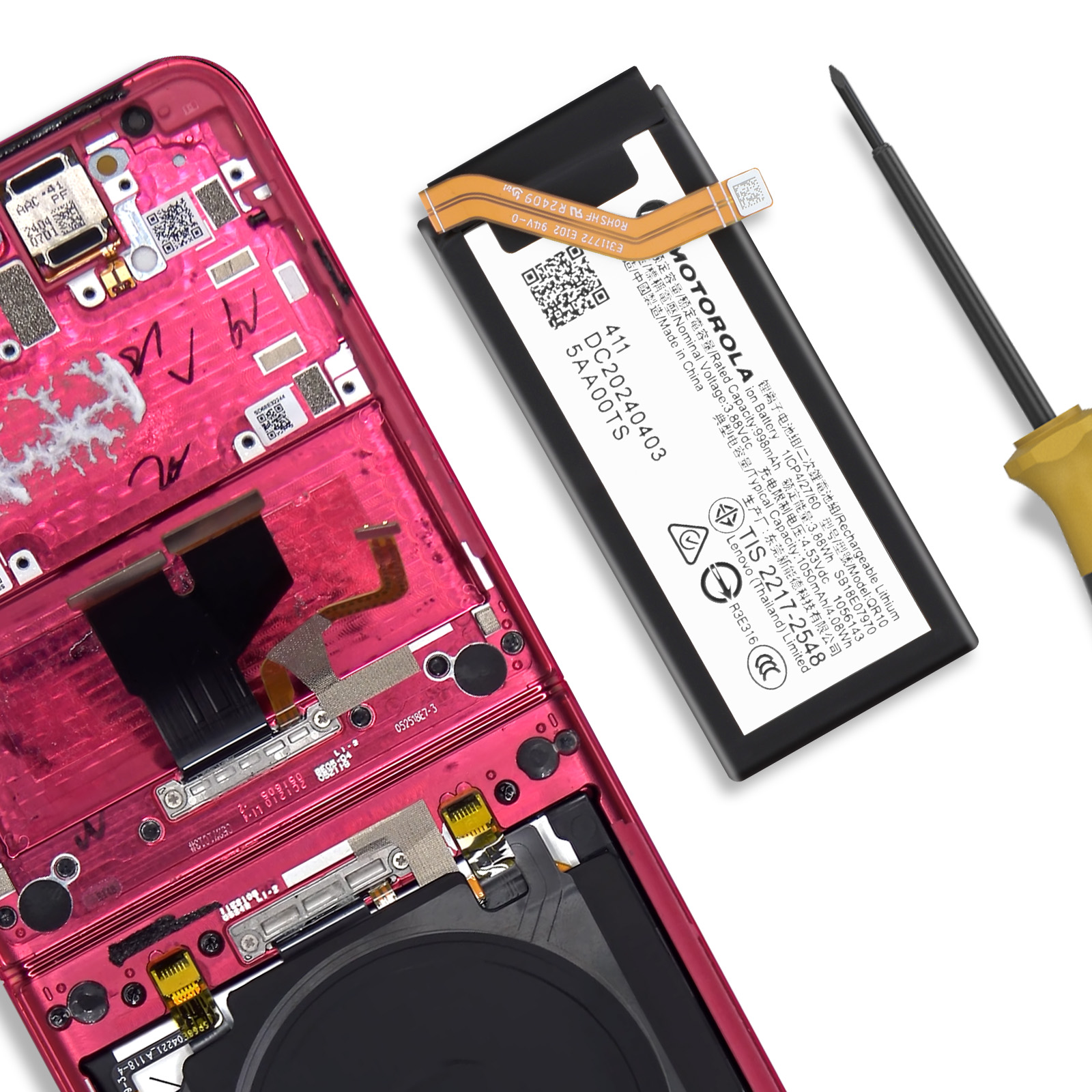 Interno rosso del telefono con batteria Motorola e cacciavite.