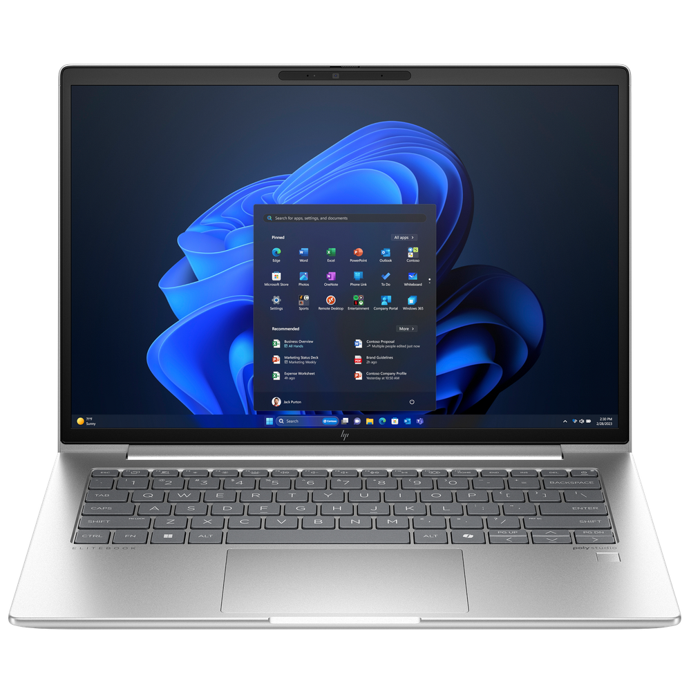 Gümüş rengi dizüstü bilgisayar, mavi dalgalı arka planla Windows 11 başlangıç menüsünü gösteriyor.