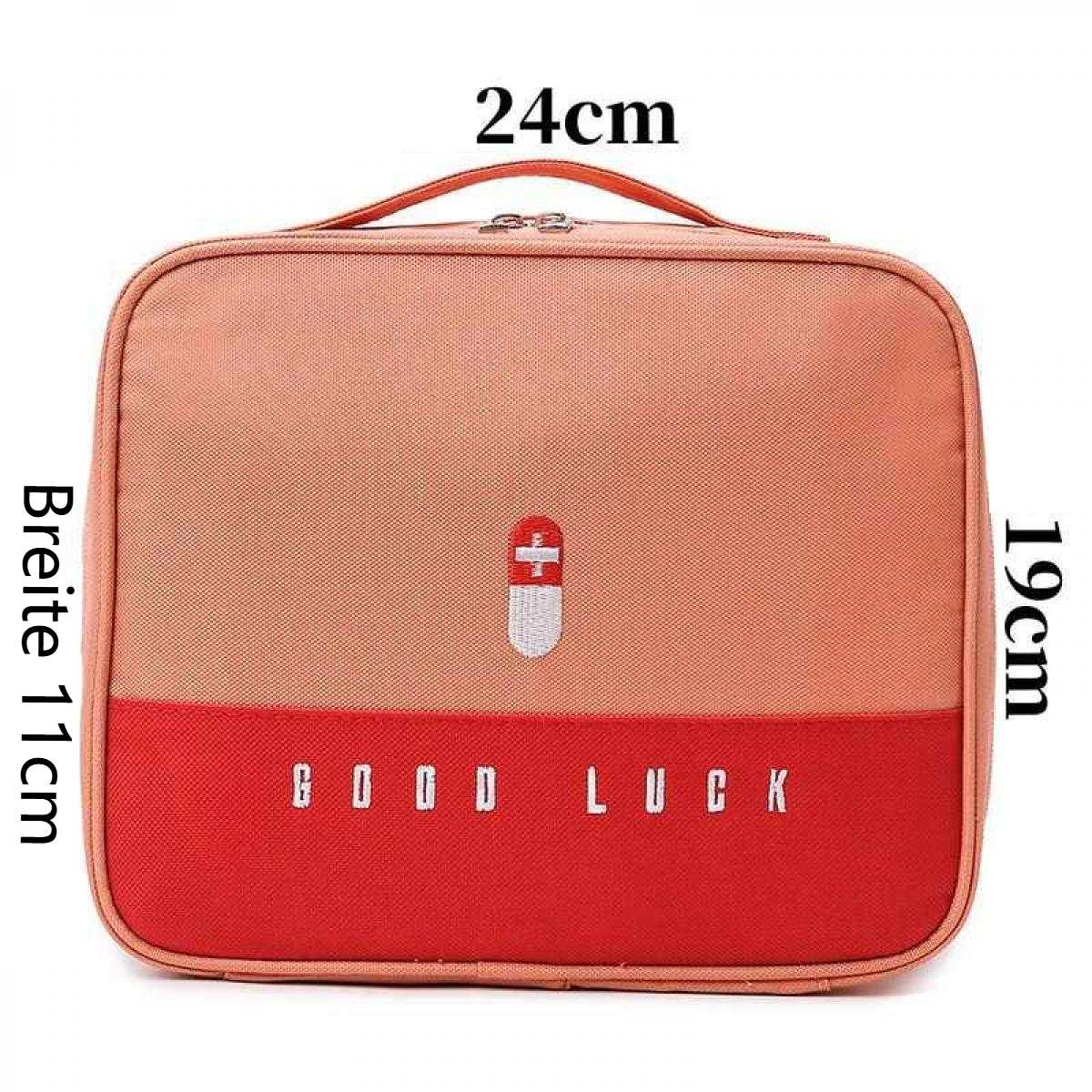 Orange und rote Tasche mit Beschriftung "GOOD LUCK" und einem Kreuz-Symbol.