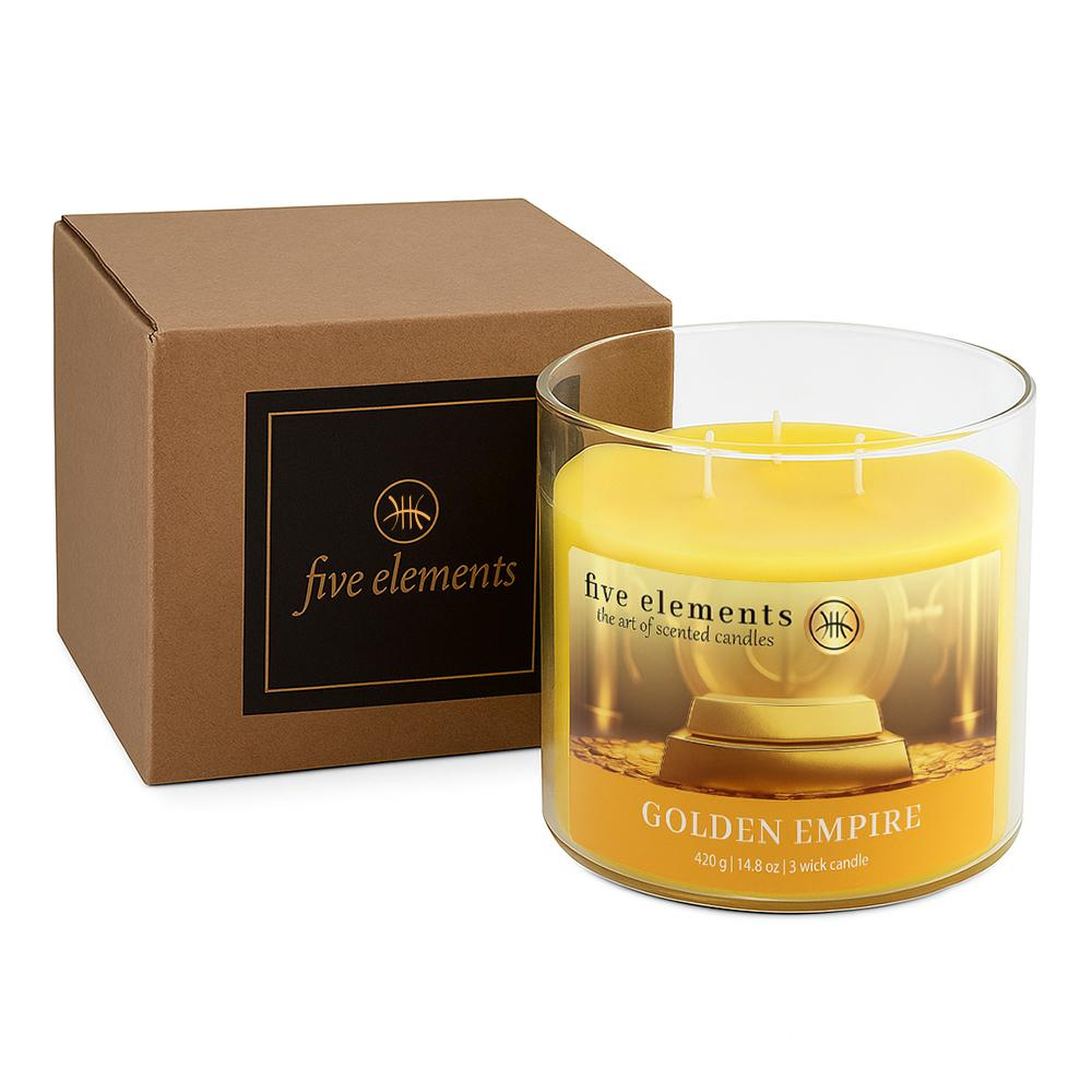 Braune Box neben einer gelben Kerze mit der Aufschrift 'Golden Empire'.