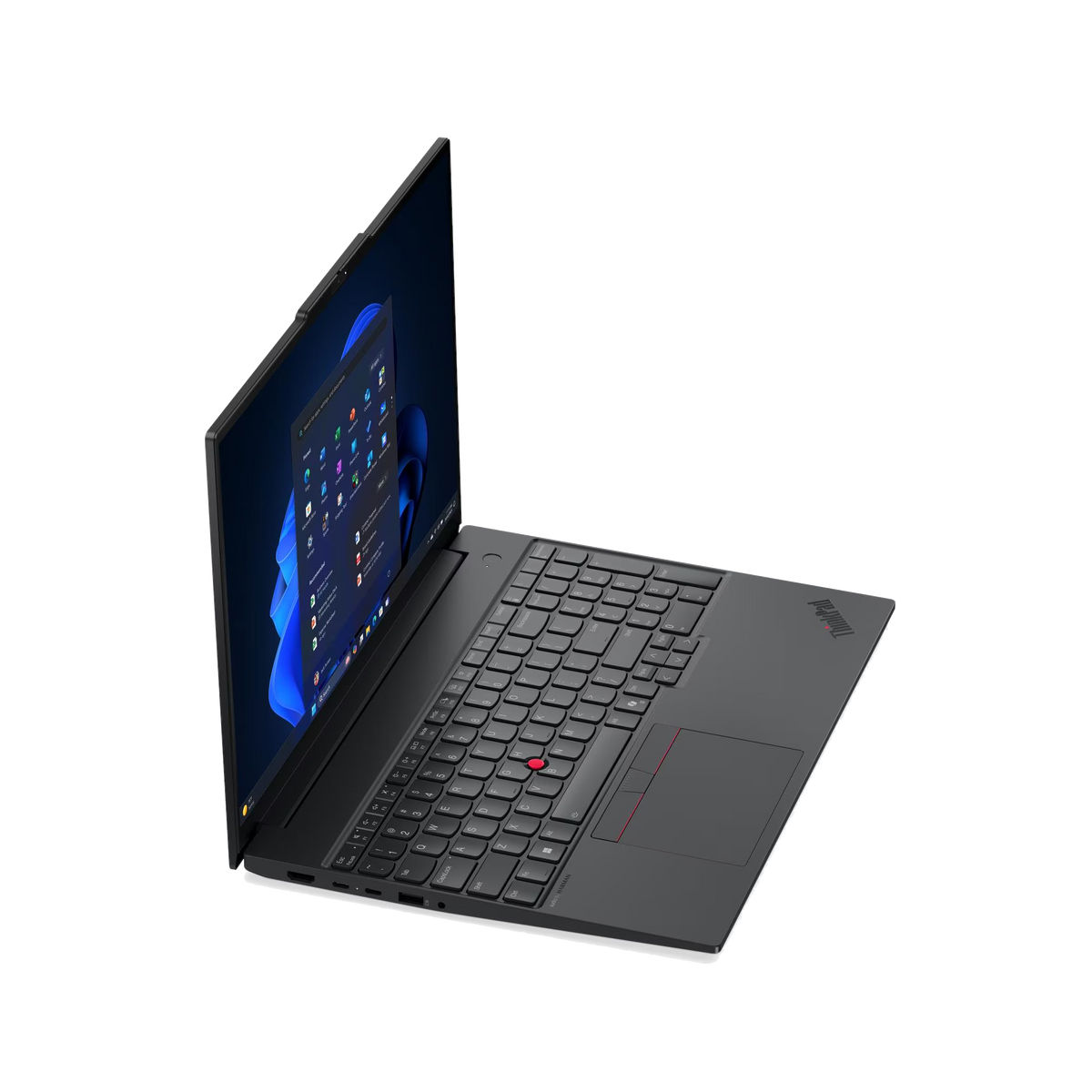 Un portátil negro con la pantalla abierta mostrando iconos de Windows. Enfoque en el teclado.
