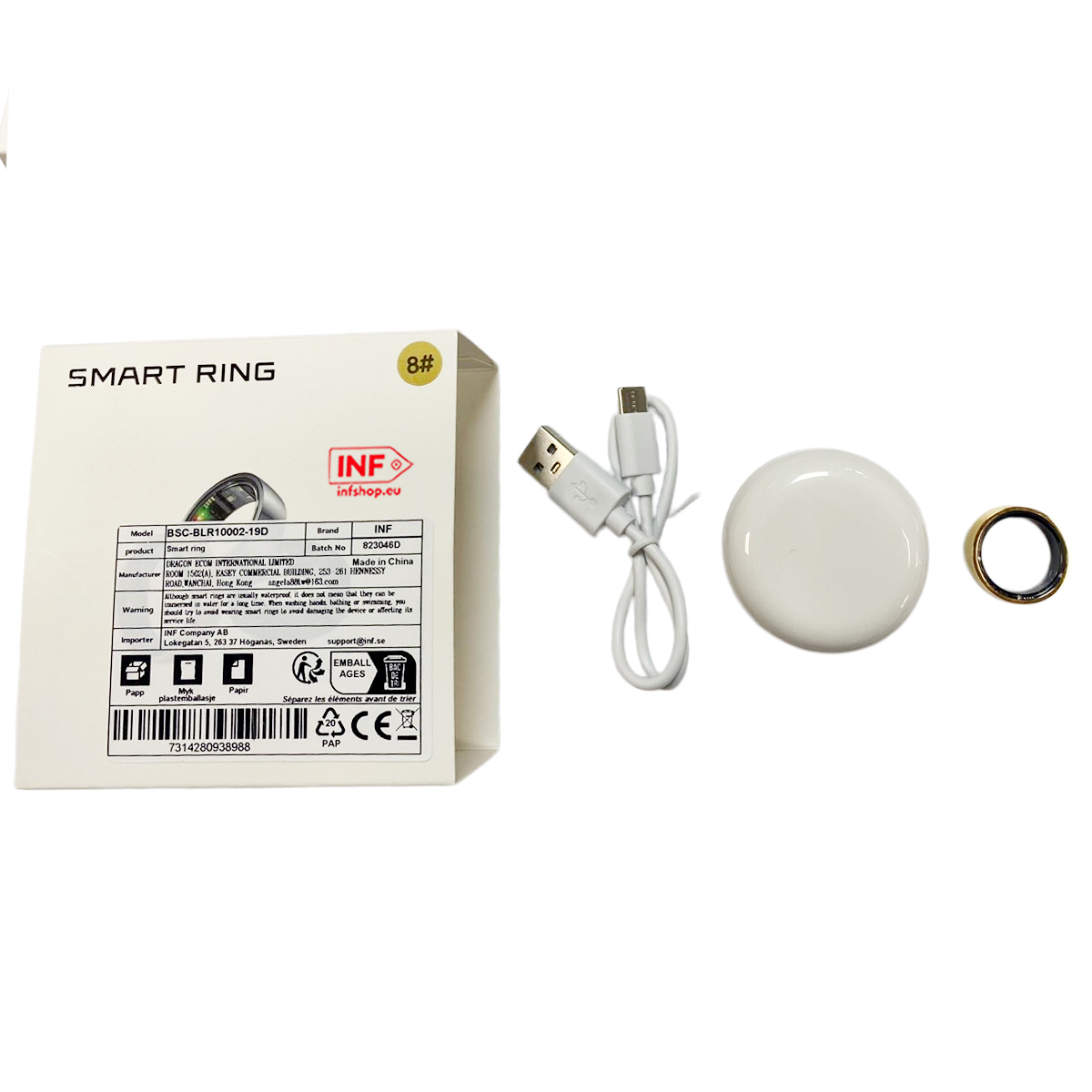Smart Ring Box, Ladekabel, weiße Ladestation und ein goldener Ring.