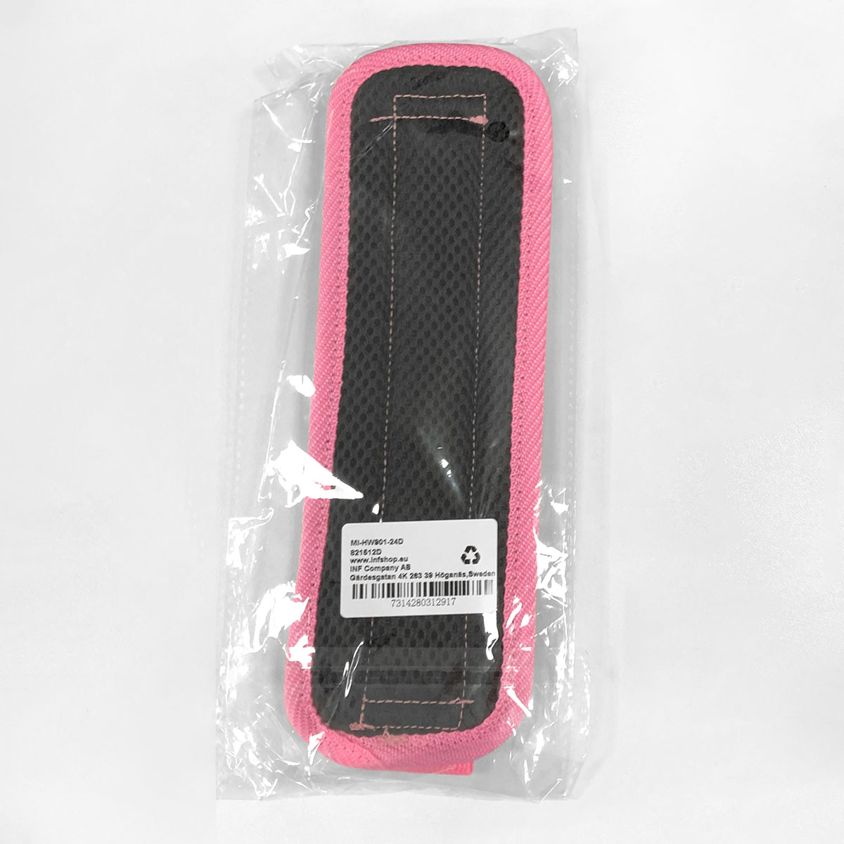 Ein rosa Schulterpolster mit schwarzem Netzgewebe, verpackt in Plastik.