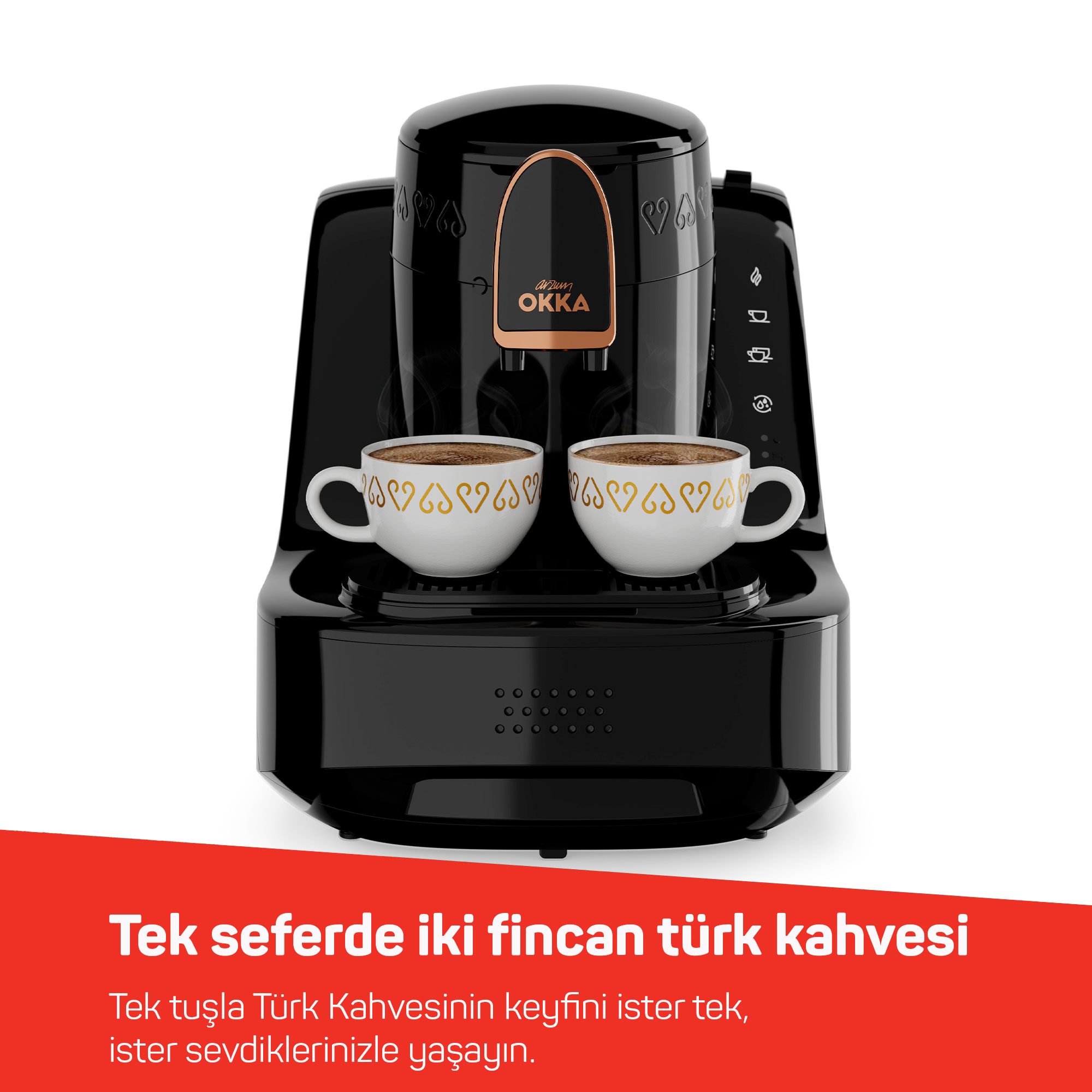Una macchina da caffè nera con due tazze di caffè turco.