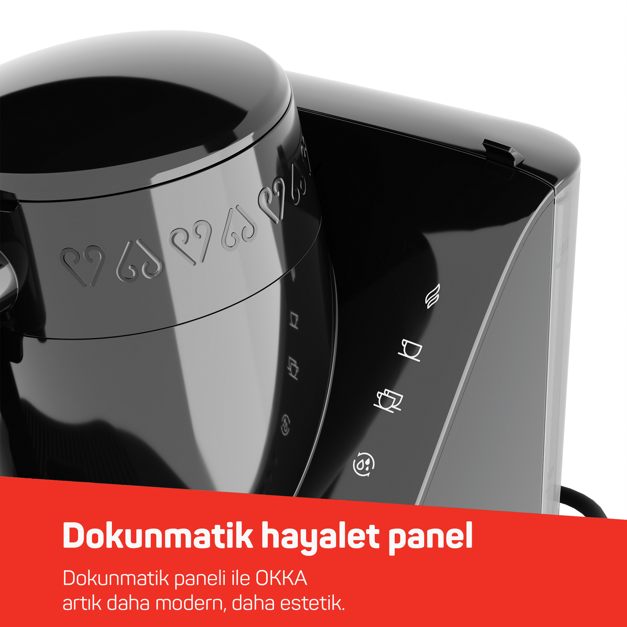 Primo piano di una macchina da caffè nera con icone touch e abbellimenti a forma di cuore.