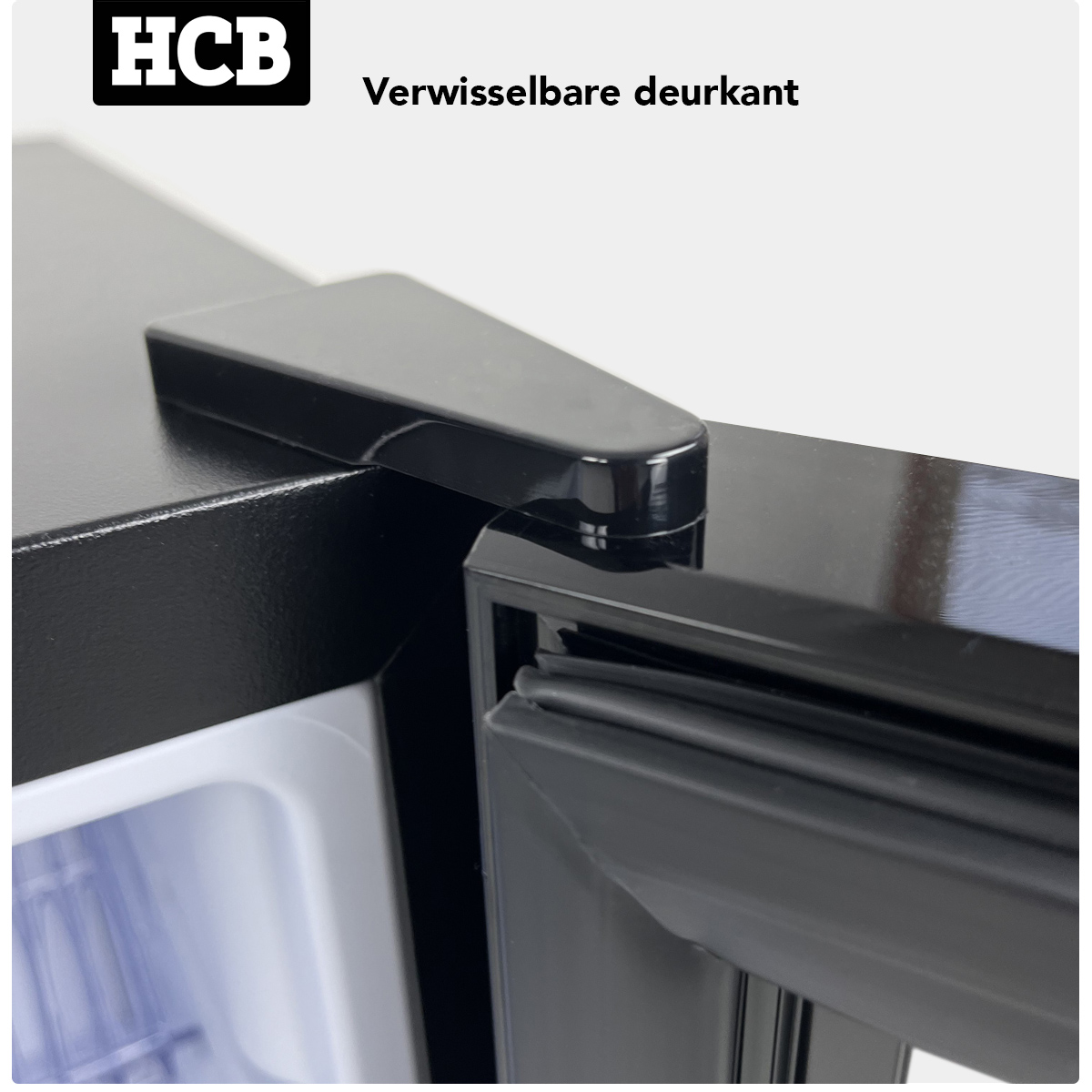 Black refrigerator lid with visible seal and HCB logo.