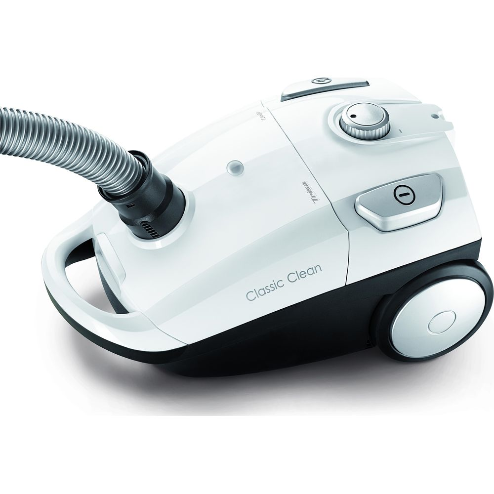 Un aspirateur blanc avec un tuyau noir et des boutons de commande.