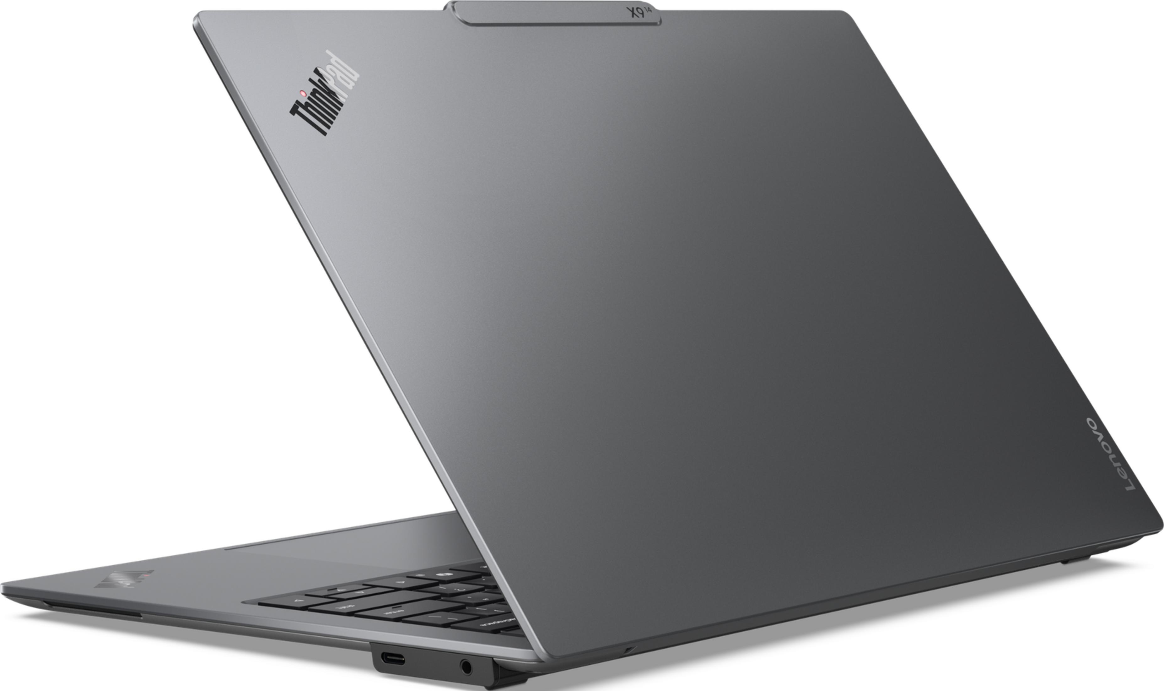 Szary laptop Lenovo ThinkPad z widoczną klawiaturą i portami.