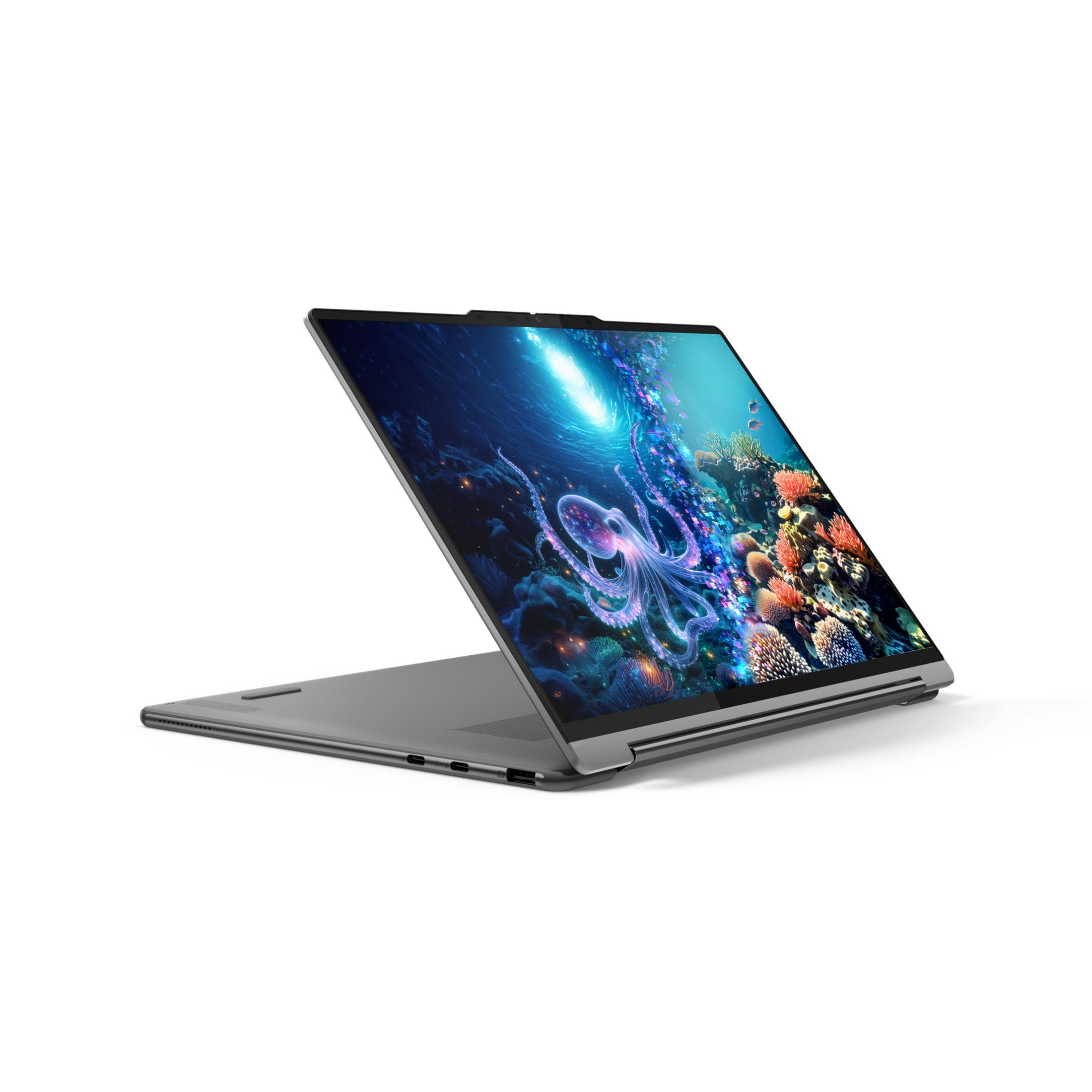 Grauer Laptop mit einem Bild eines leuchtenden Oktopus im Ozean auf dem Bildschirm.