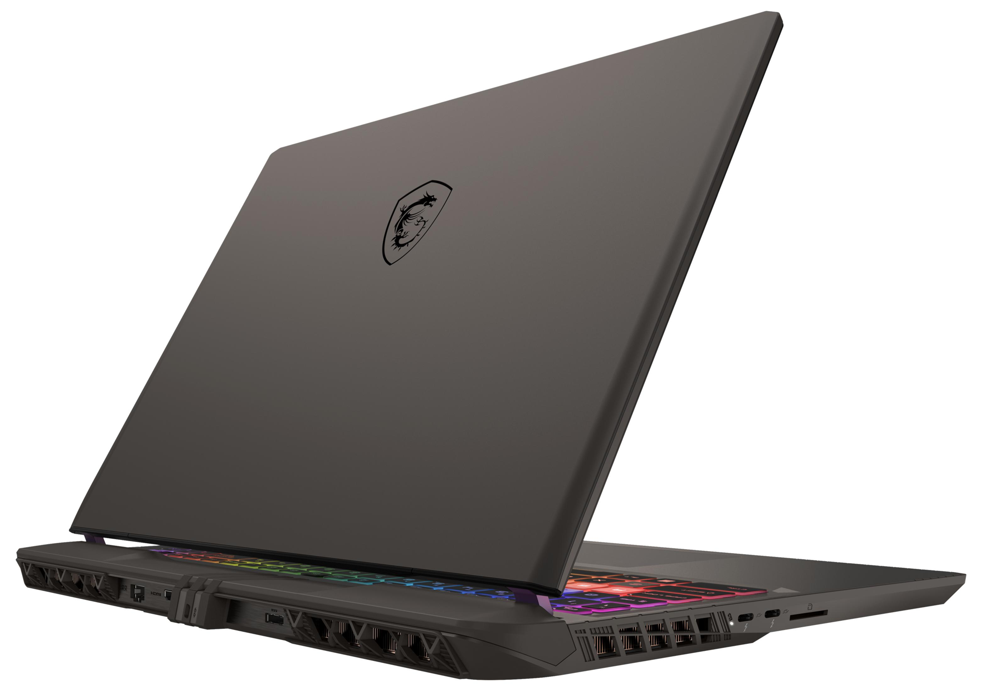 Zamknięty czarny laptop MSI z podświetlaną klawiaturą i logo smoka.