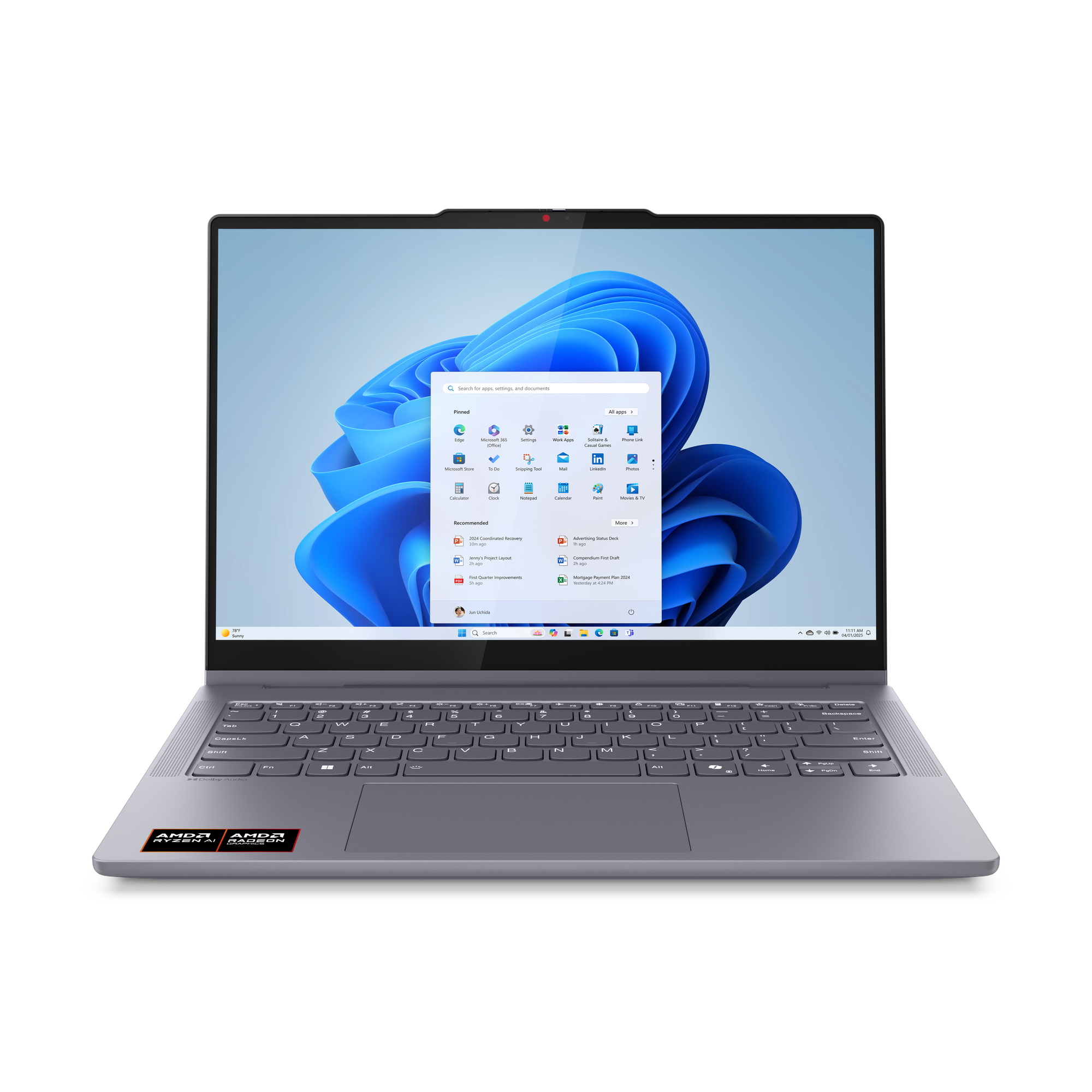 Szary laptop wyświetlający menu Start systemu Windows 11 na ekranie.