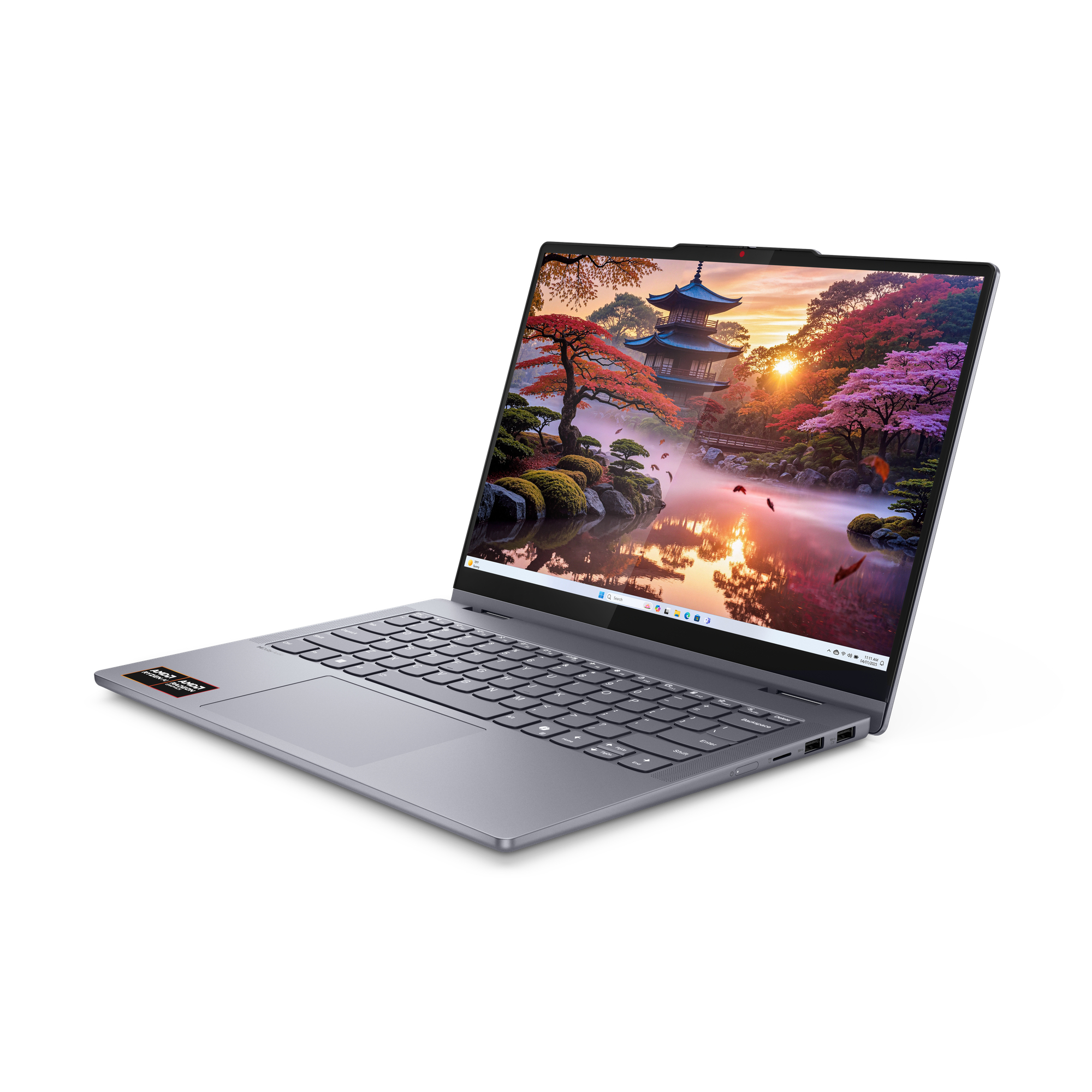 Laptop z japońskim ogrodem na ekranie o zachodzie słońca.
