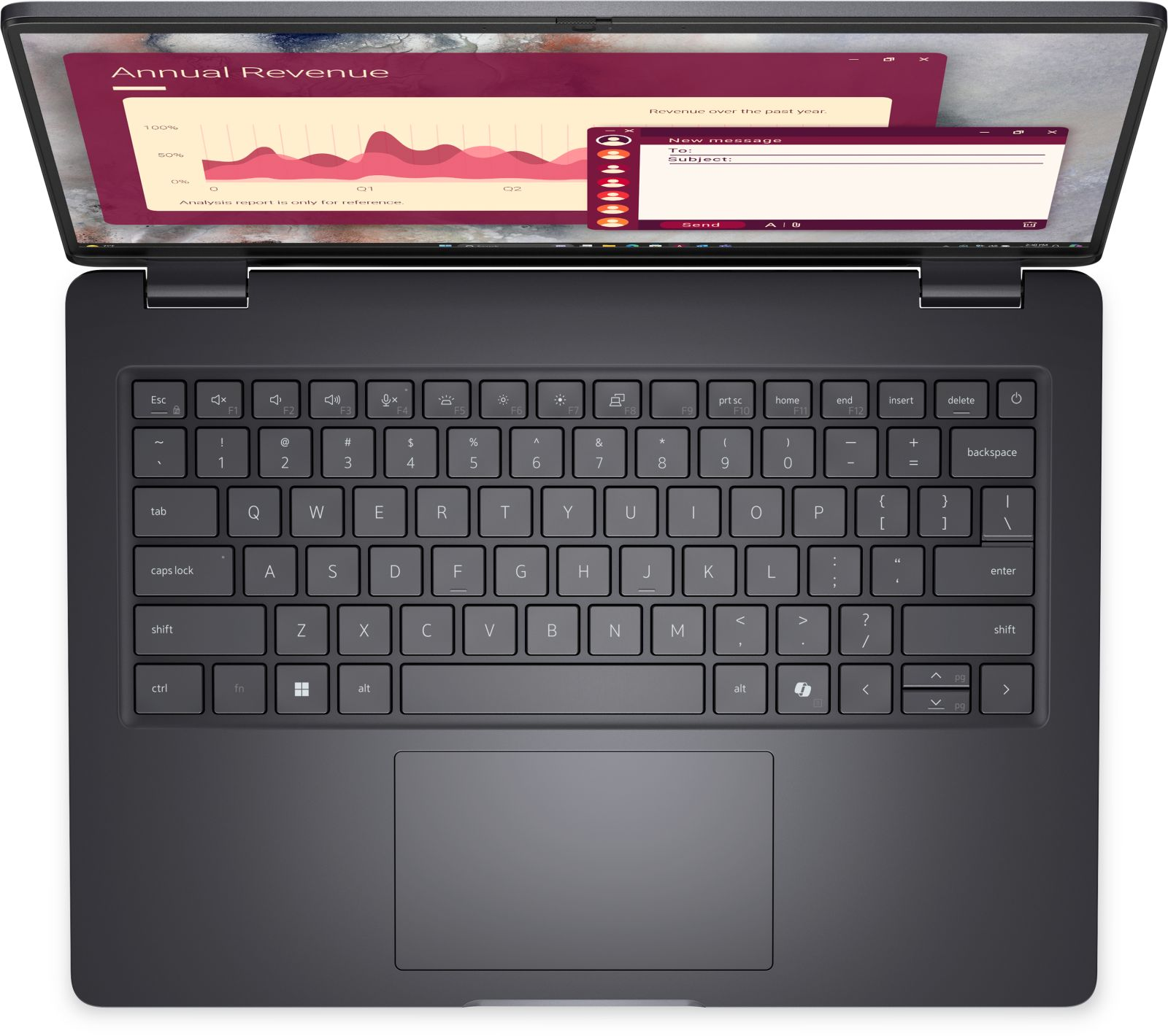 Otwarty laptop pokazuje wykres "Roczne Przychody" i okno poczty e-mail.