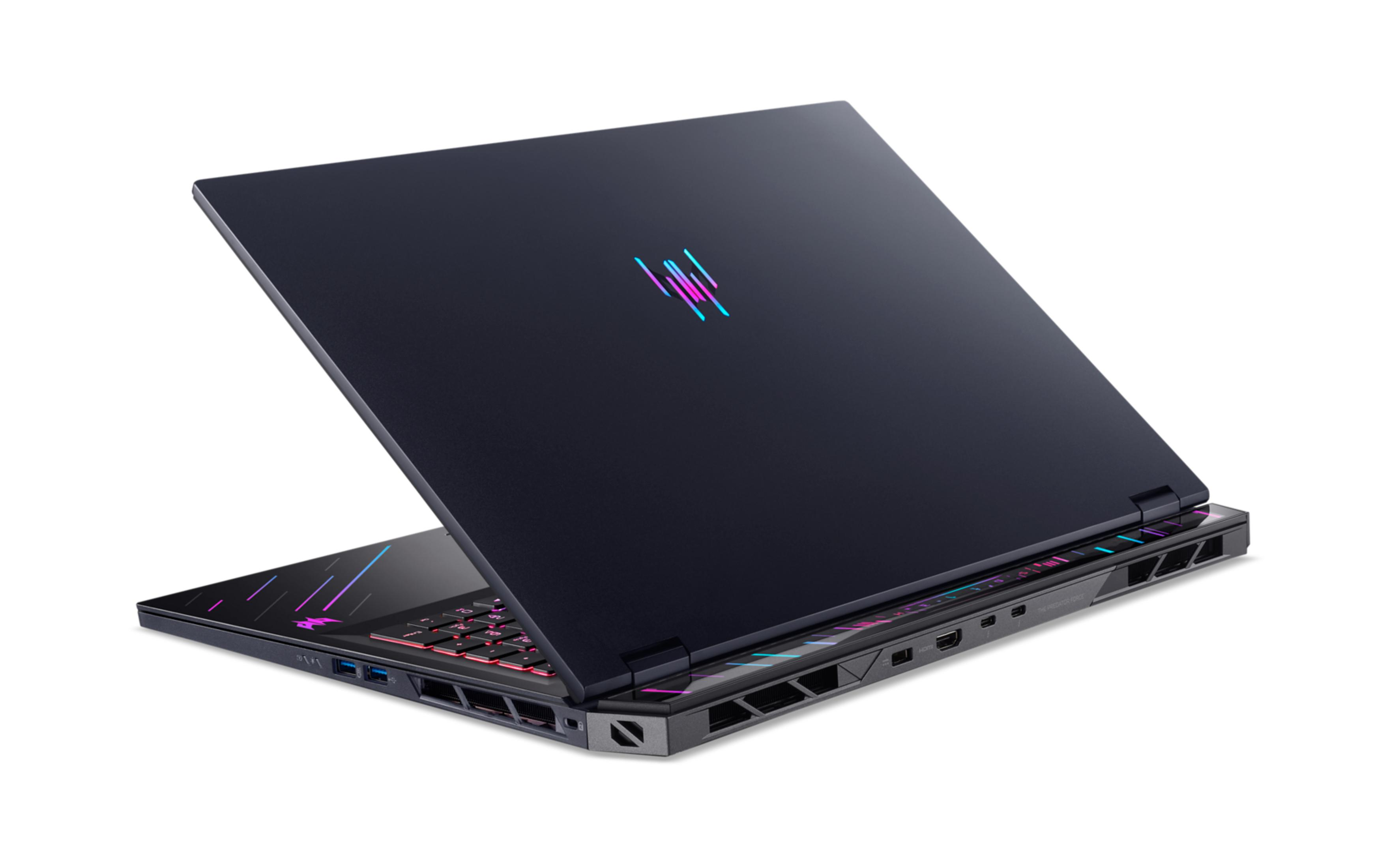 Dunkelblauer Gaming-Laptop mit beleuchteter Tastatur und Logo.