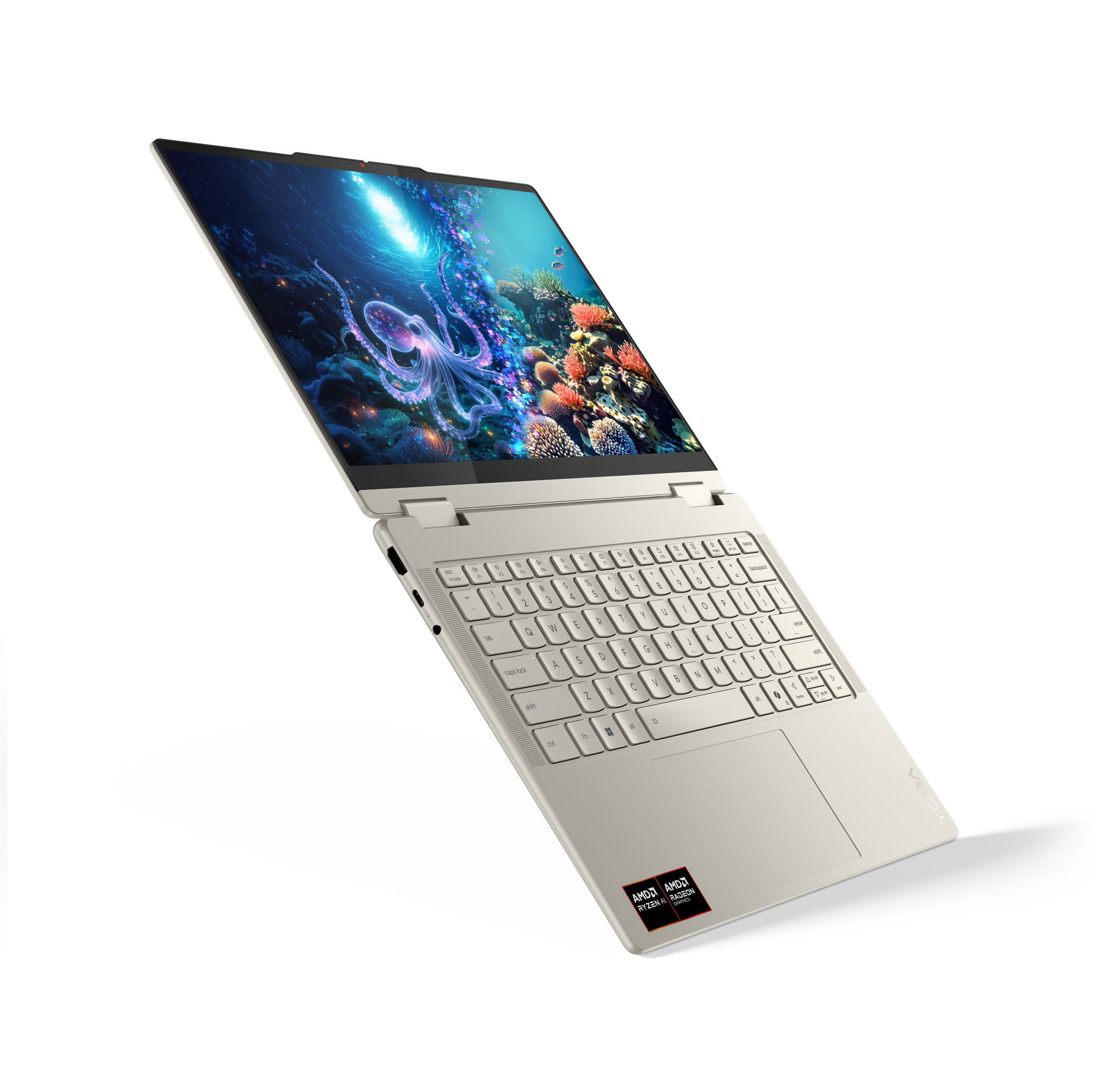 Otwarty laptop z podwodnym motywem i ośmiornicą na ekranie.