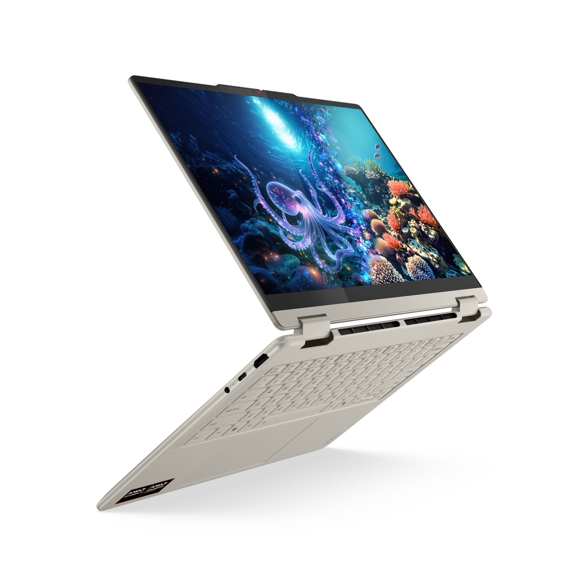 Otwarty laptop wyświetla podwodną scenę z ośmiornicą i koralem na ekranie.