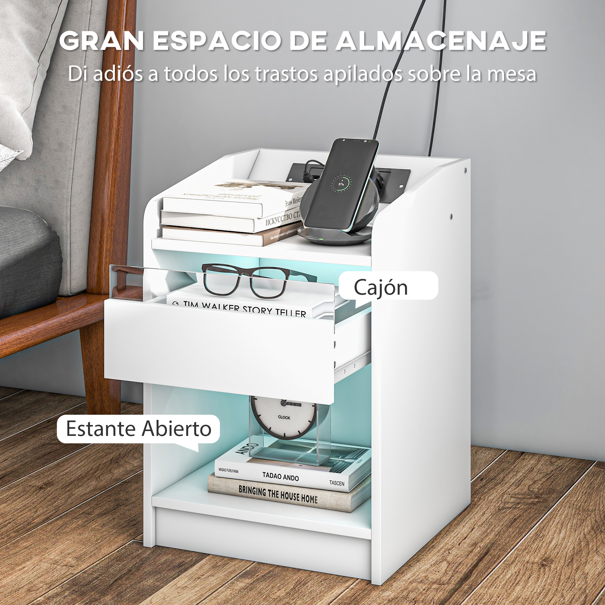Una mesita de noche blanca con libros, gafas, reloj y teléfono.