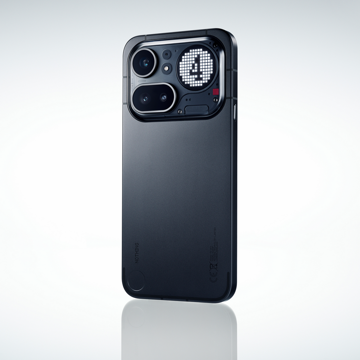 Smartphone grigio scuro con fotocamere e motivo a pois luminosi sul retro.