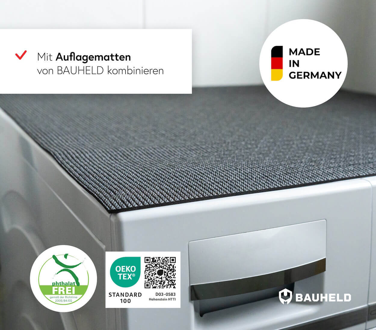 Graue Matte auf weißer Waschmaschine. Siegel: Made in Germany, OEKO-TEX.