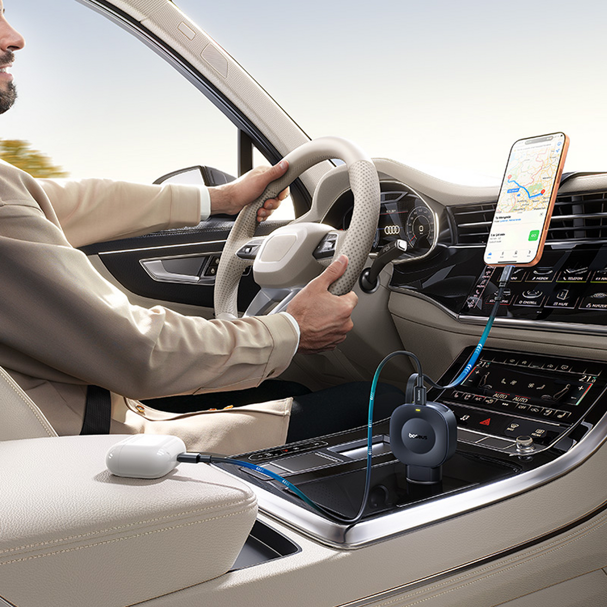 Uomo guida auto con navigatore sul telefono e accessori di ricarica sul cruscotto.