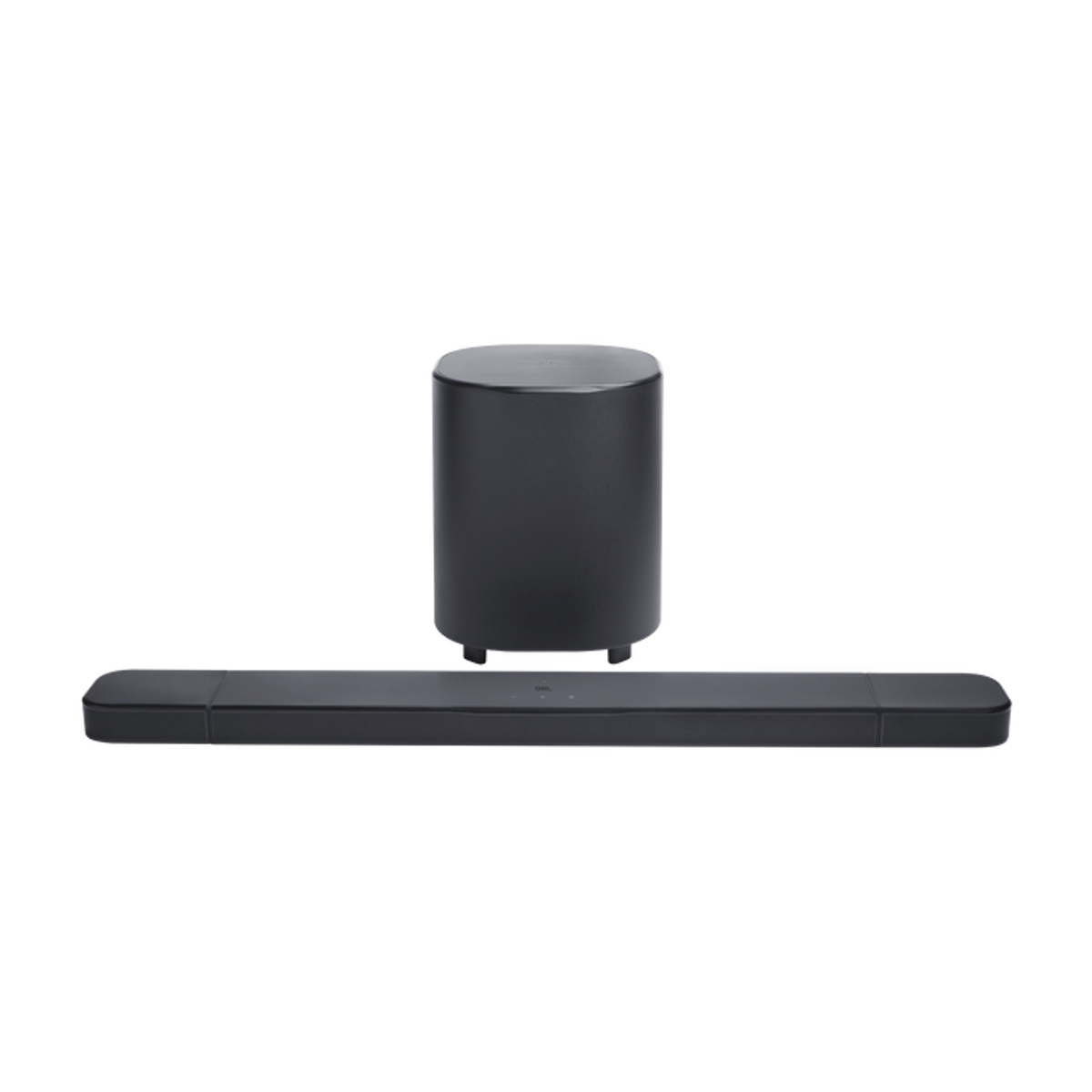 Subwoofer y barra de sonido negros sobre fondo negro.