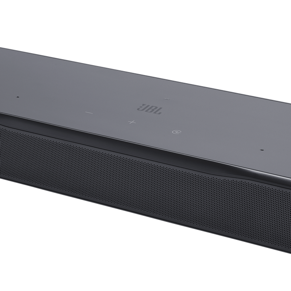 Barra de sonido JBL gris con frontal perforado y controles táctiles.