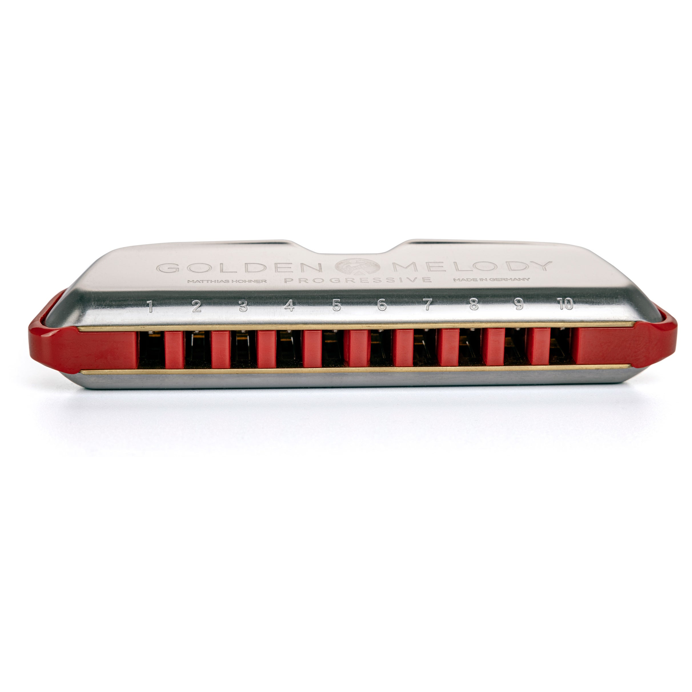 Een zilveren mondharmonica met rode accenten en nummers 1-10.
