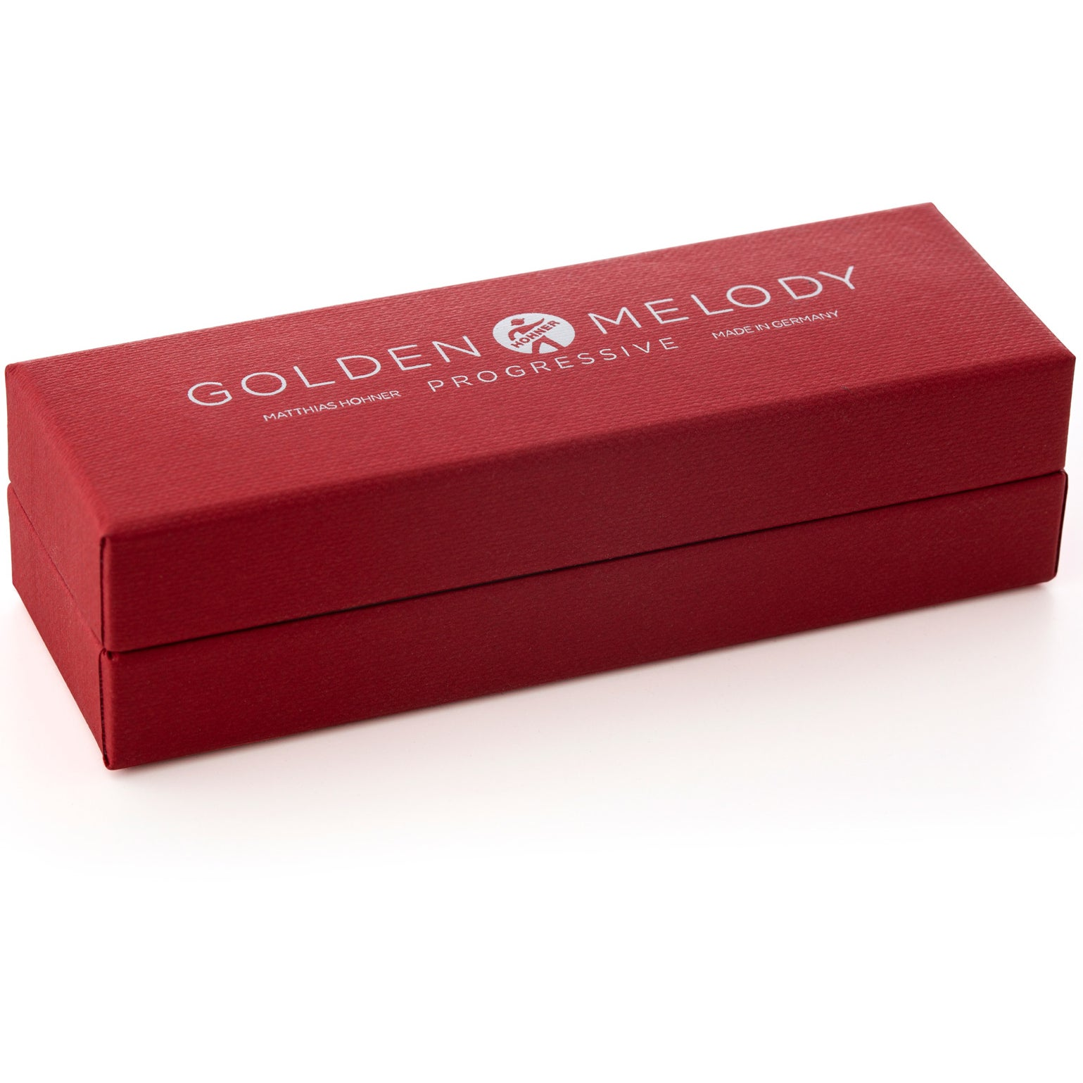 Rode doos met "Golden Melody" en "Made in Germany" opdruk.