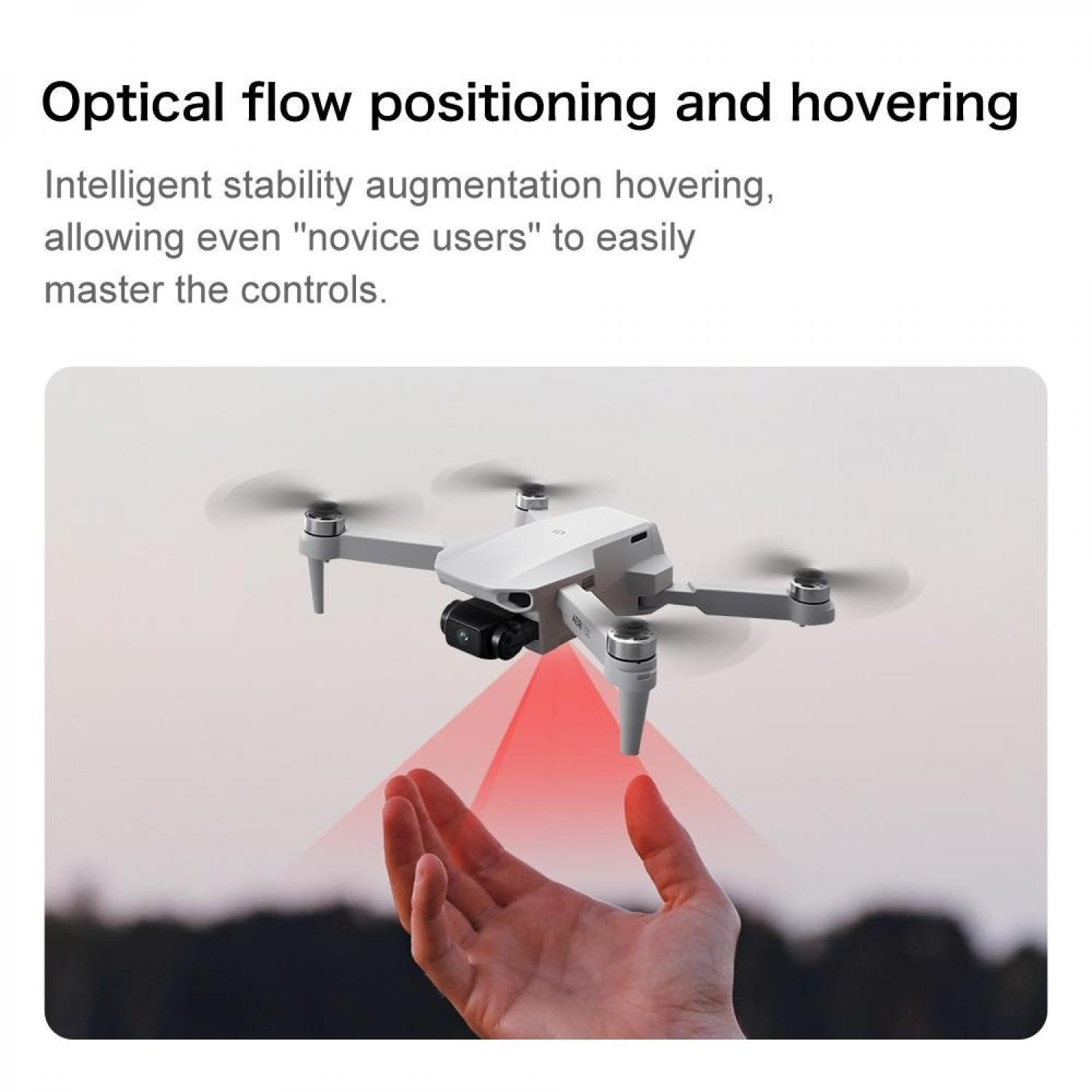 Eine weiße Drohne schwebt über einer geöffneten Hand, mit roten Lichtstrahlen.