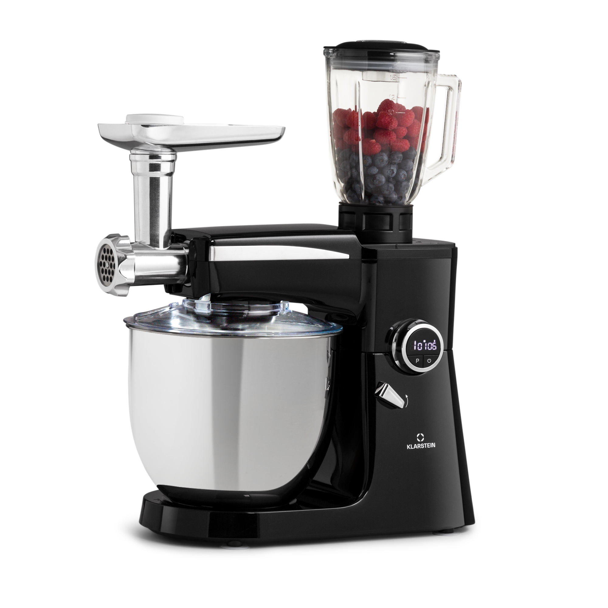 Accessorio robot da cucina nero con tritacarne e caraffa frullatore piena di frutti di bosco.