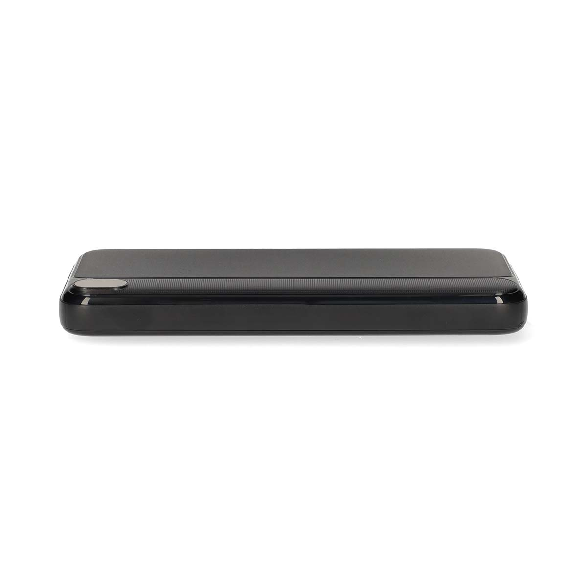 A black rectangular power bank device lies on a white background.