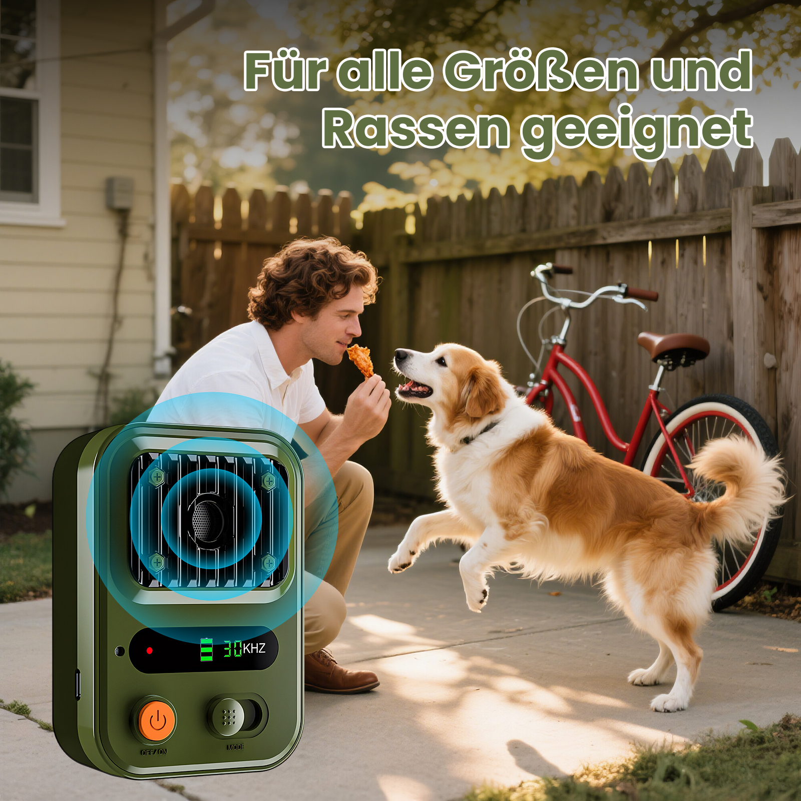 Mann füttert Hund mit Leckerli, Ultraschallgerät im Vordergrund, Fahrrad im Hintergrund.